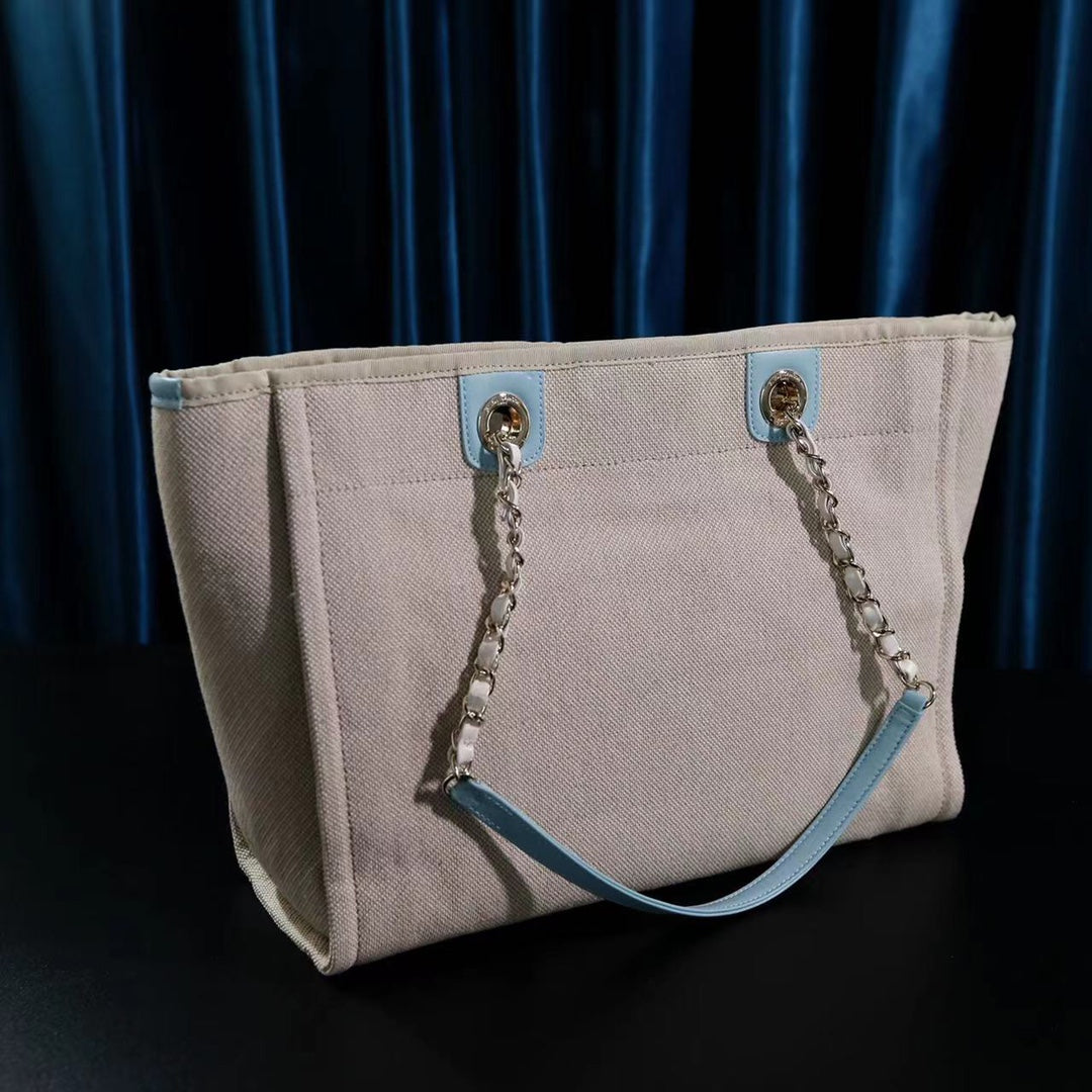 CHANEL DEAUVILLE LARGE 39 TOTE BAG IN BEIGE CANVAS WITH LIGHT BLUE CHAIN
