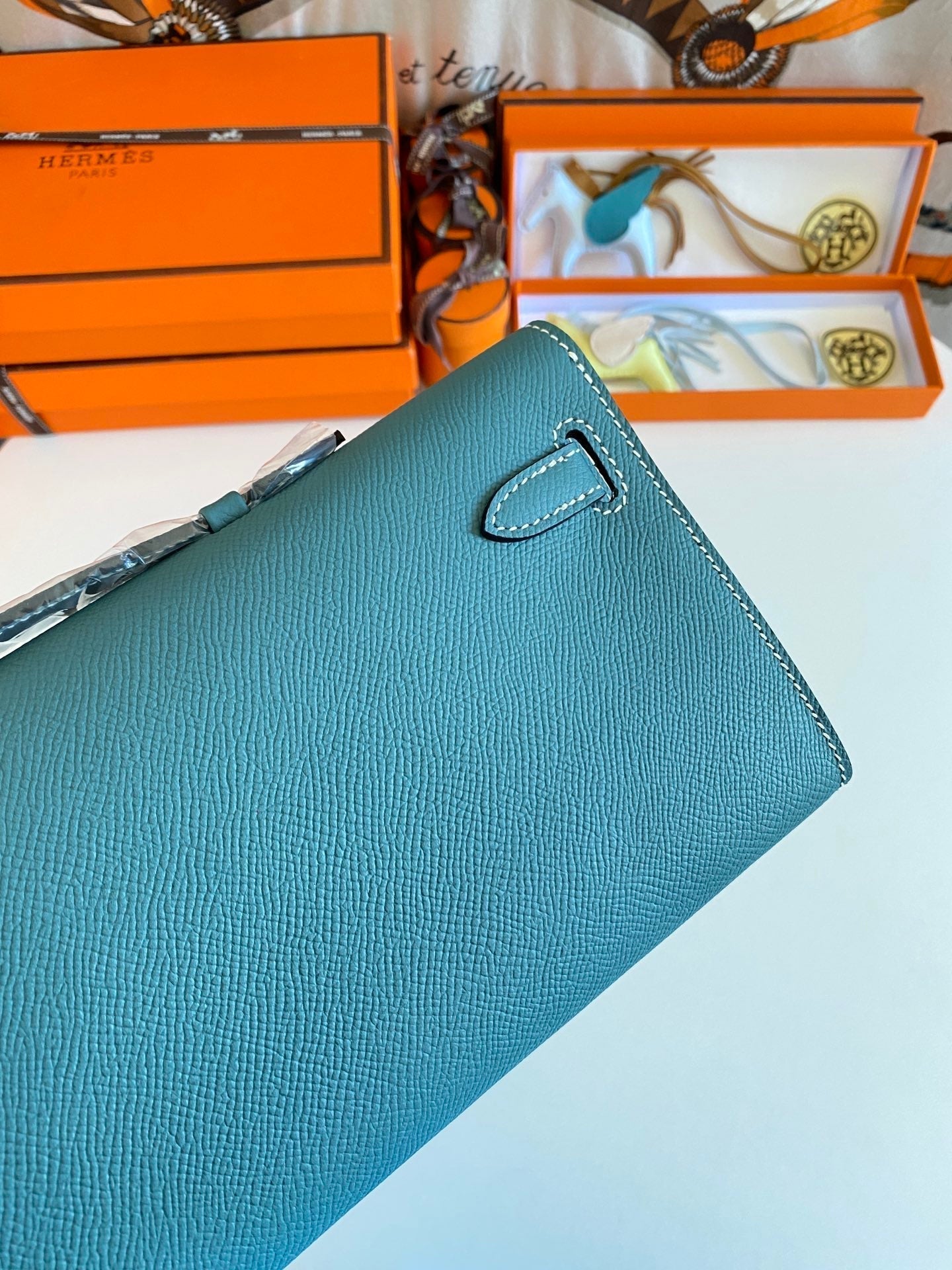 HERMES KELLY CUT 31 IN AZURE BLUE CALFSKIN WITH SILVER HARDWARE