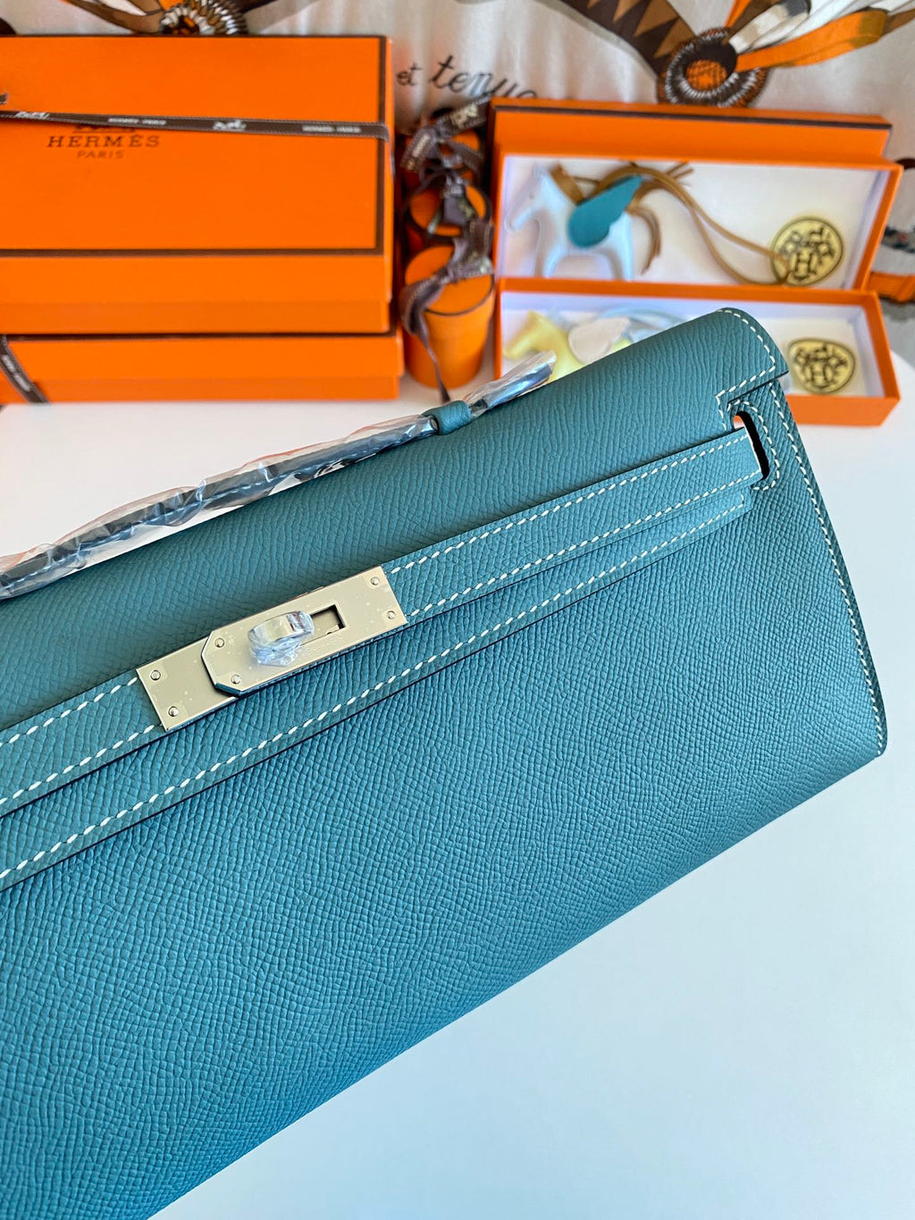 HERMES KELLY CUT 31 IN AZURE BLUE CALFSKIN WITH SILVER HARDWARE