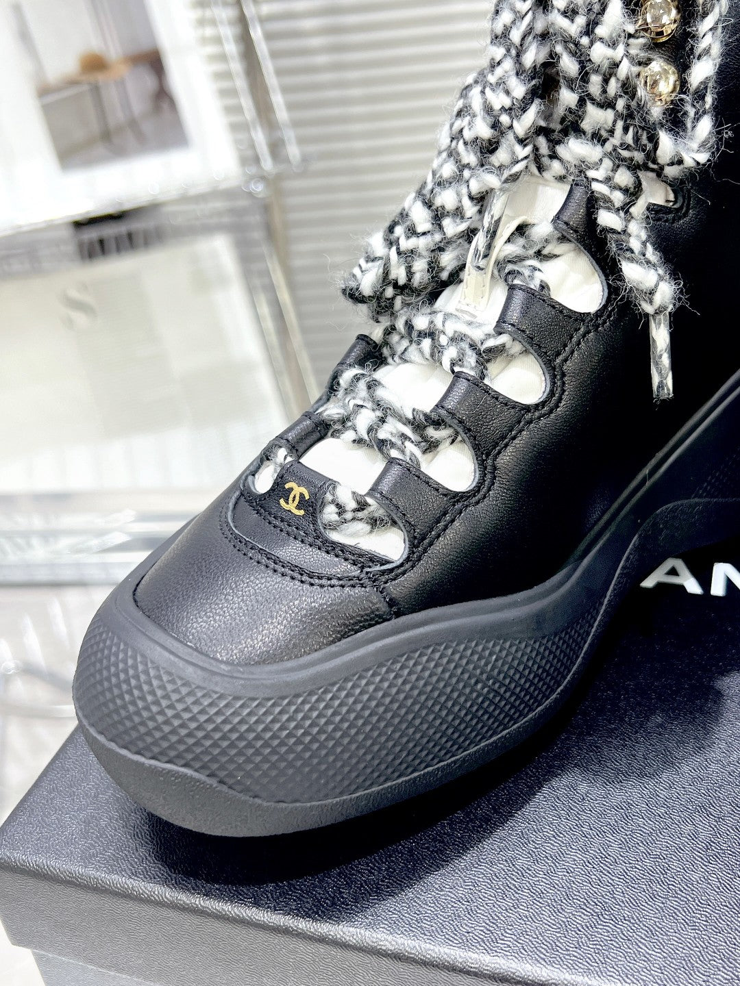 CHANEL CANO ALTO SNEAKER IN BLACK CALFSKIN AND RUBBER