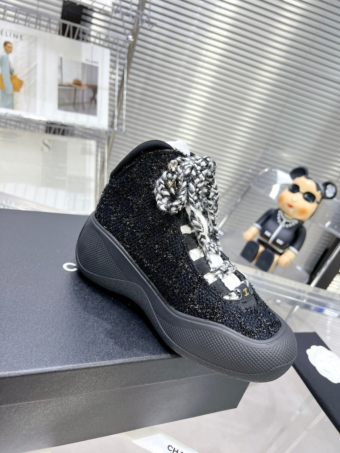 CHANEL CANO ALTO SNEAKER IN BLACK TWEED AND RUBBER