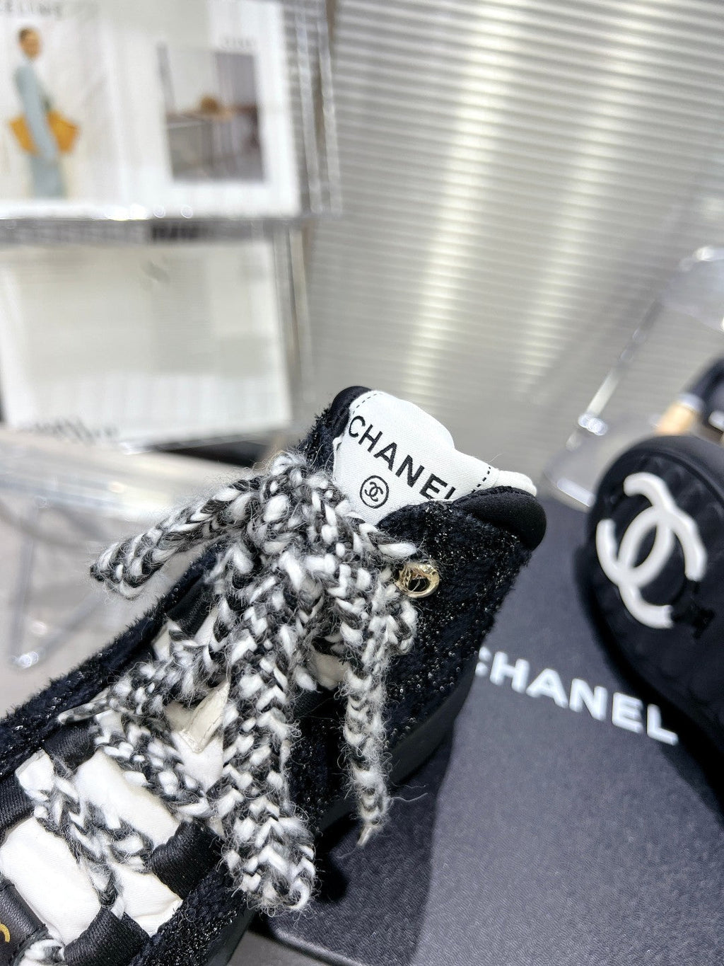 CHANEL CANO ALTO SNEAKER IN BLACK TWEED AND RUBBER