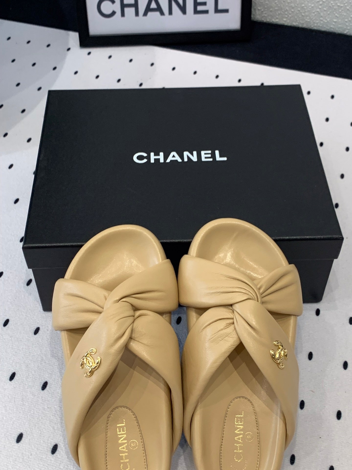 CHANEL TWISTED SLIPPERS IN DARK CREAM LAMBSKIN