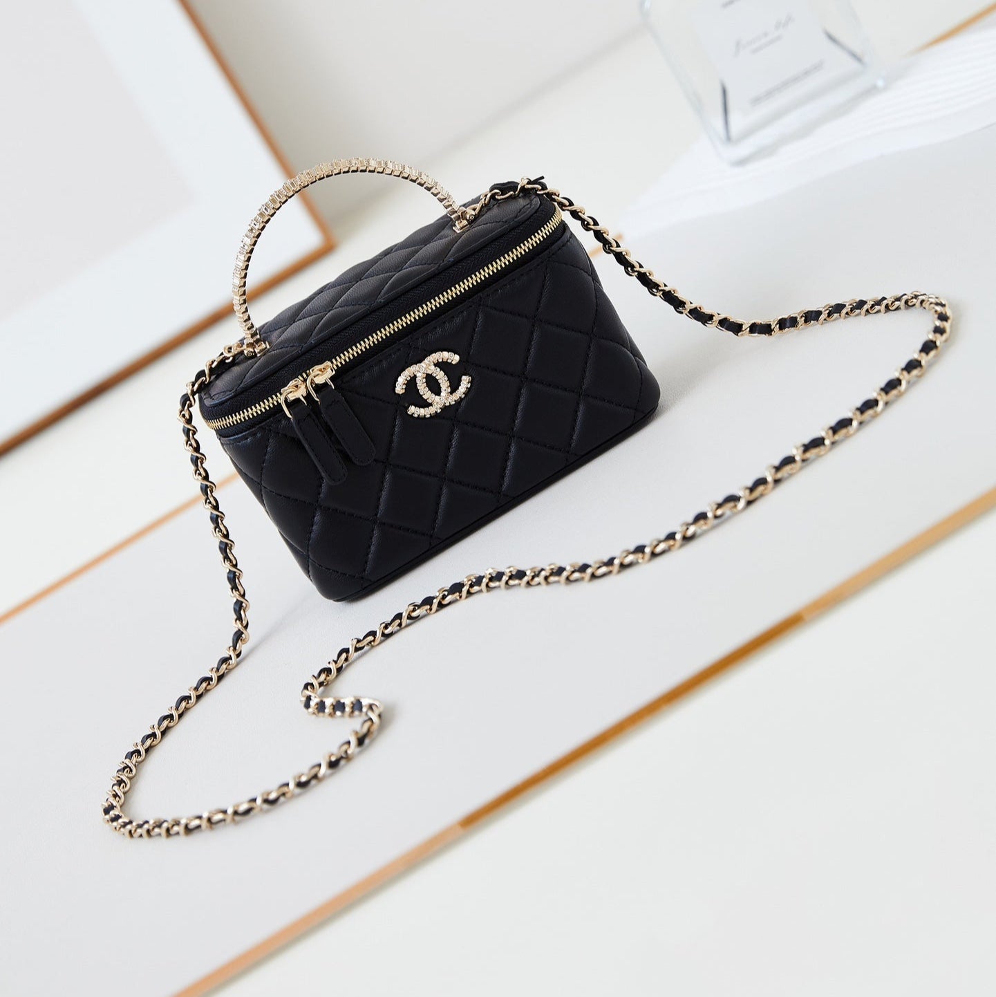 CHANEL 25S MINI VANITY BAG 16 CM IN BLACK LAMBSKIN WITH CRYSTAL-EMBELLISHED  LOGO