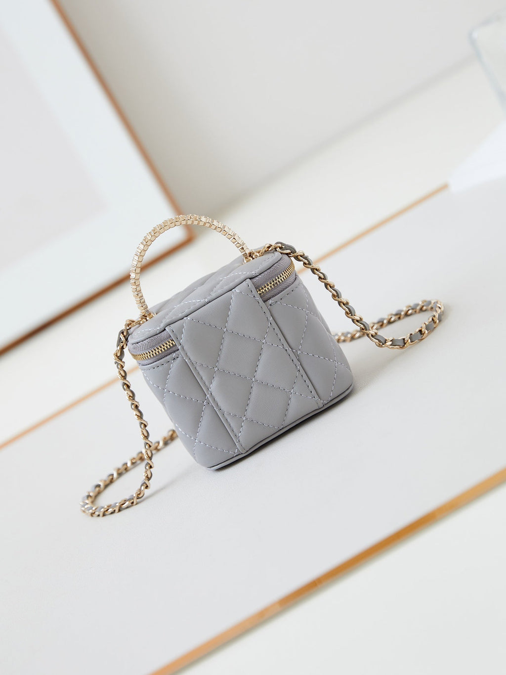 CHANEL 25S MINI VANITY BAG 11 CM IN GREY LAMBSKIN WITH CRYSTAL-EMBELLISHED  LOGO