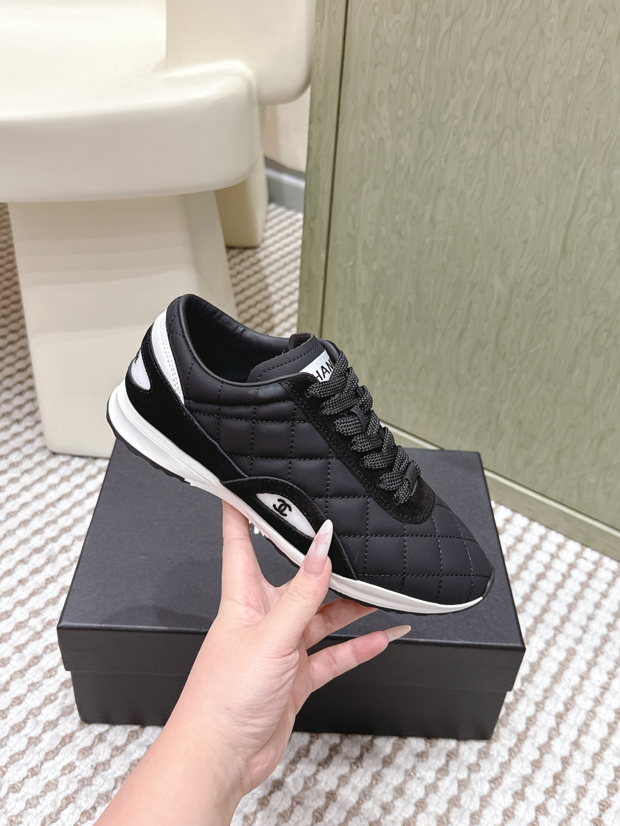 CHANEL 25S SNEAKERS IN BLACK CALFSKIN AND SUEDE