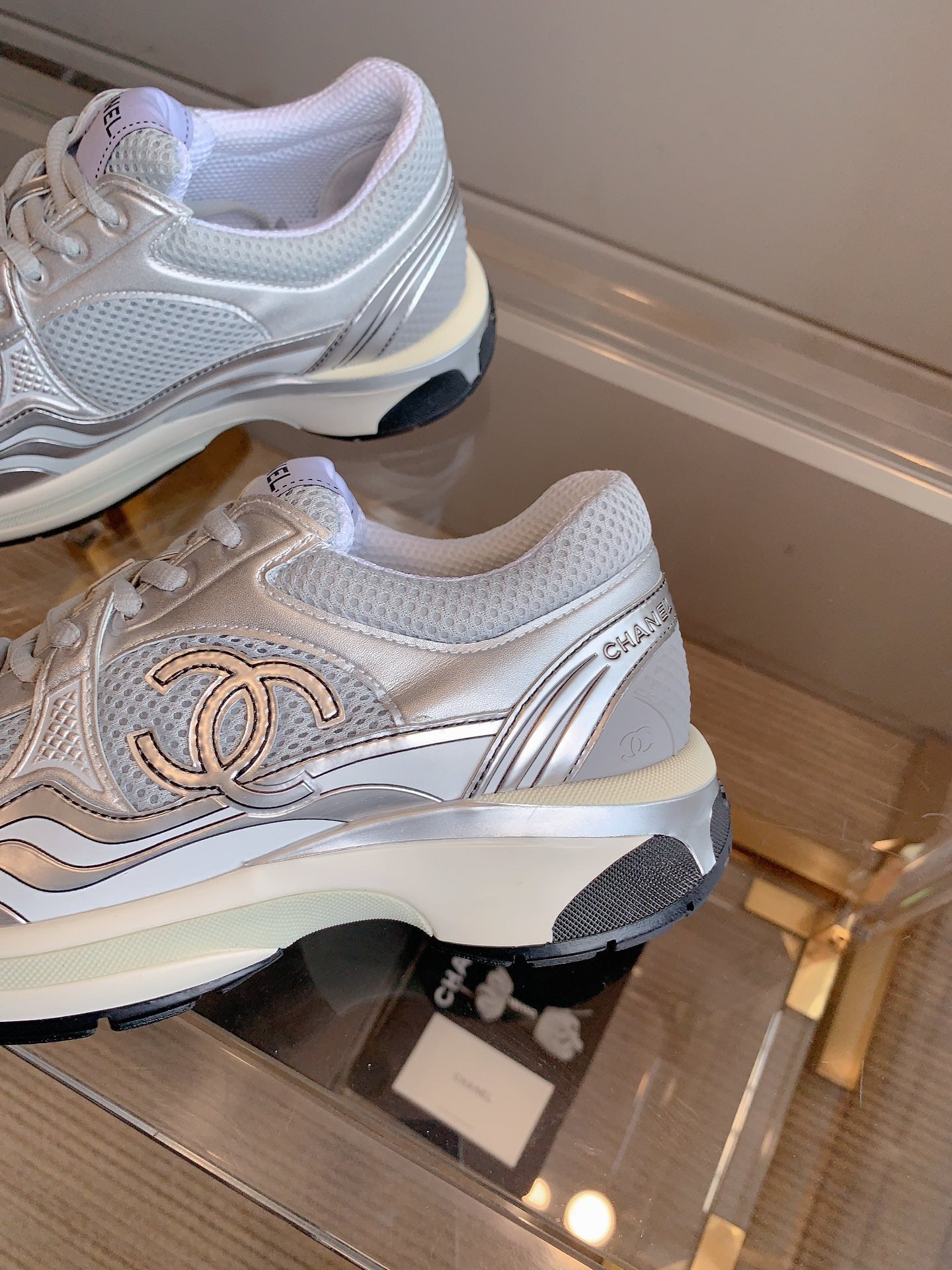 CHANEL SNEAKERS IN GLOSSY SILVER CALFSKIN AND MESH