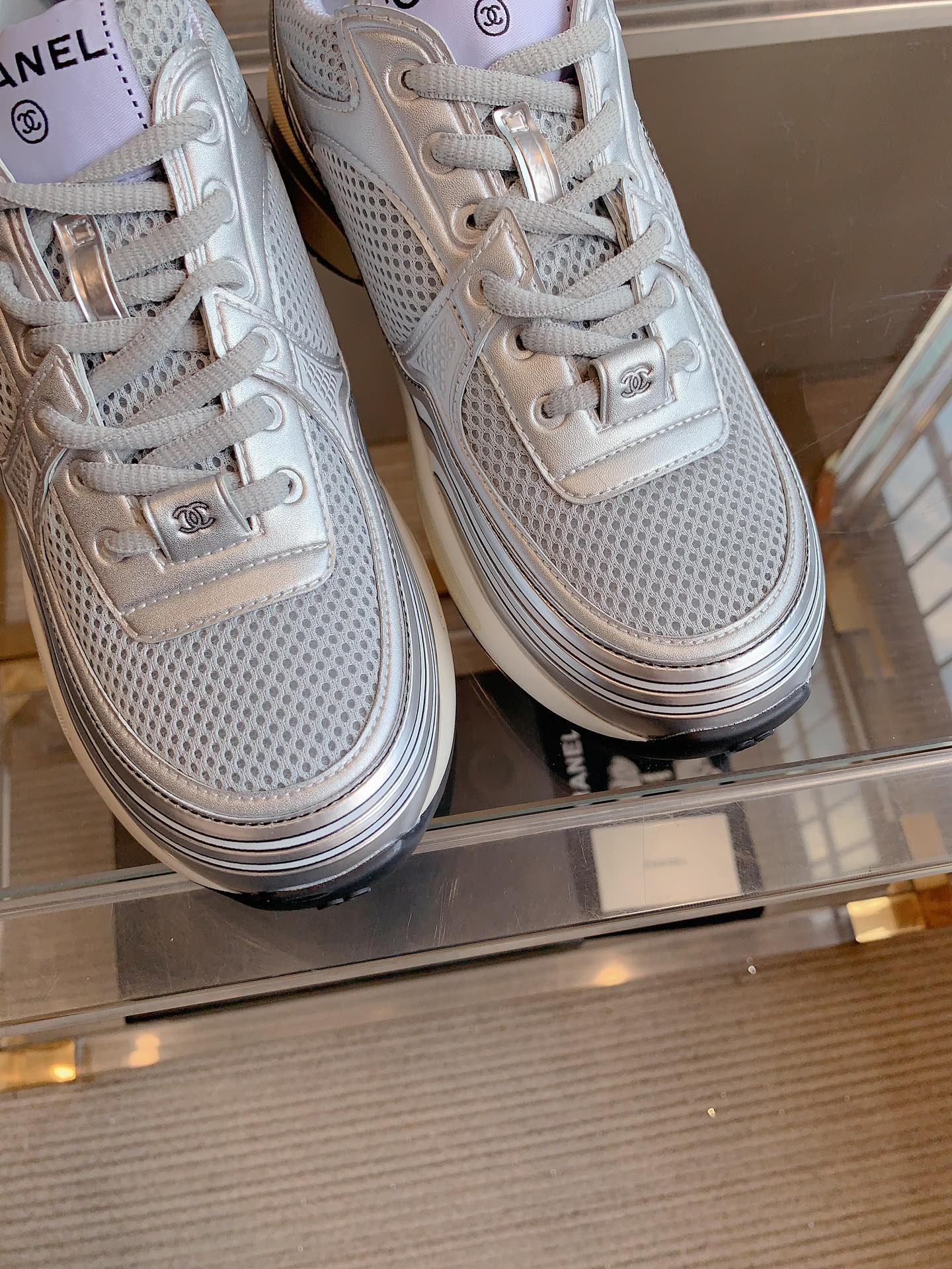 CHANEL SNEAKERS IN GLOSSY SILVER CALFSKIN AND MESH
