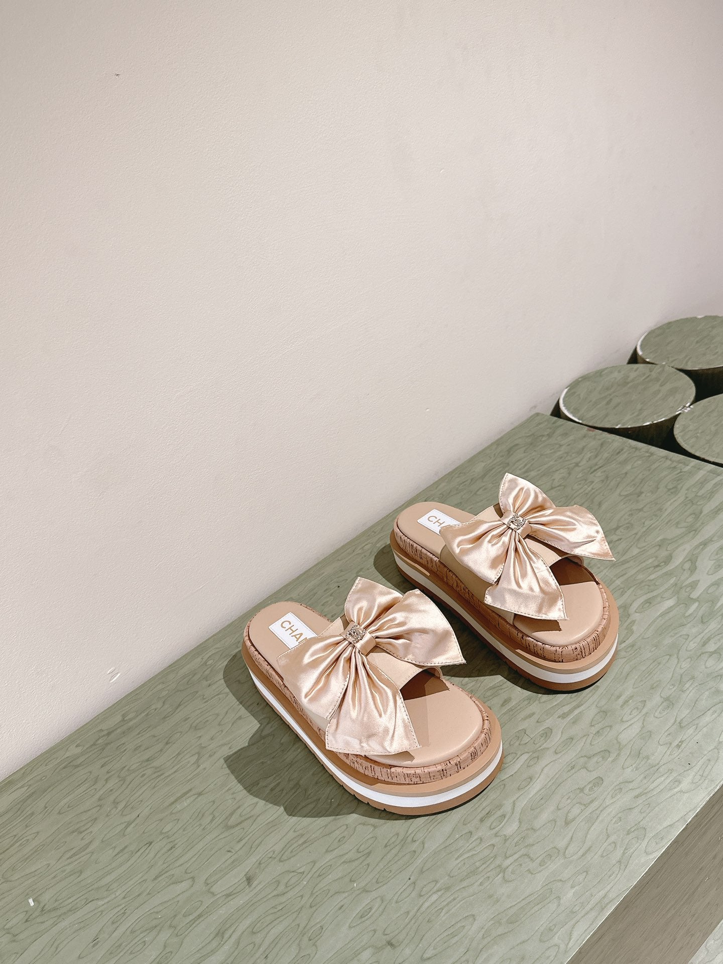 CHANEL SLIPPERS WITH SILK BOW IN BEIGE ALMOND COWHIDE