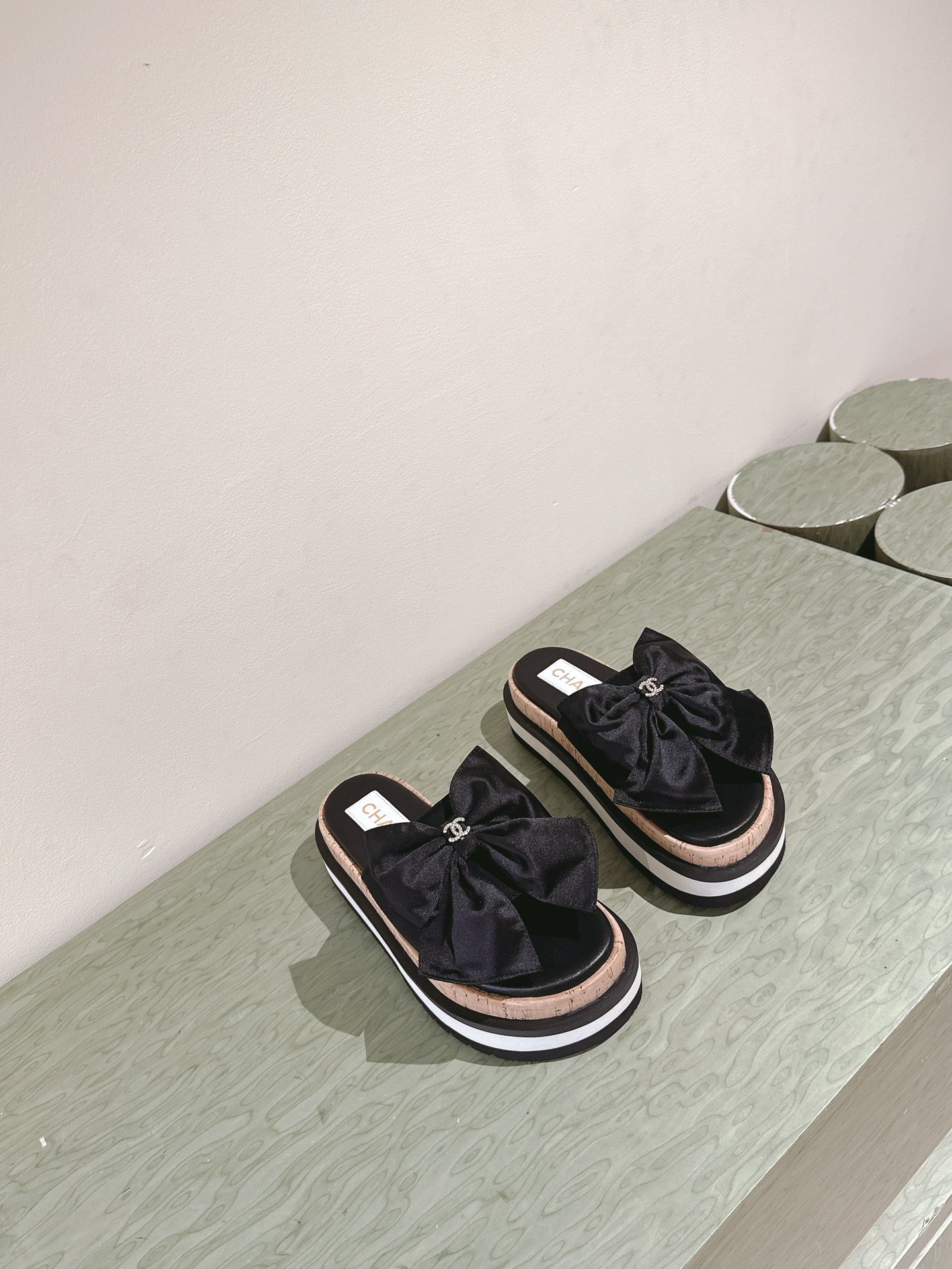 CHANEL SLIPPERS WITH SILK BOW IN BLACK COWHIDE