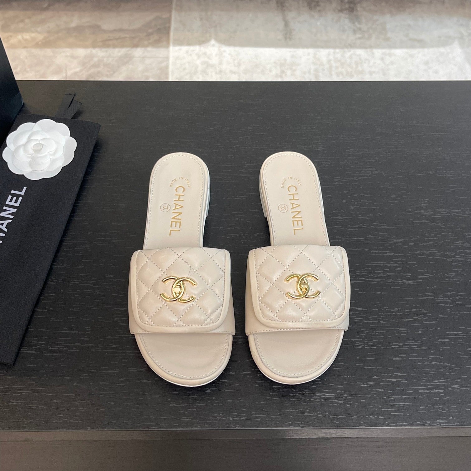 CHANEL FLAT MULE IN WHITE LAMBSKIN