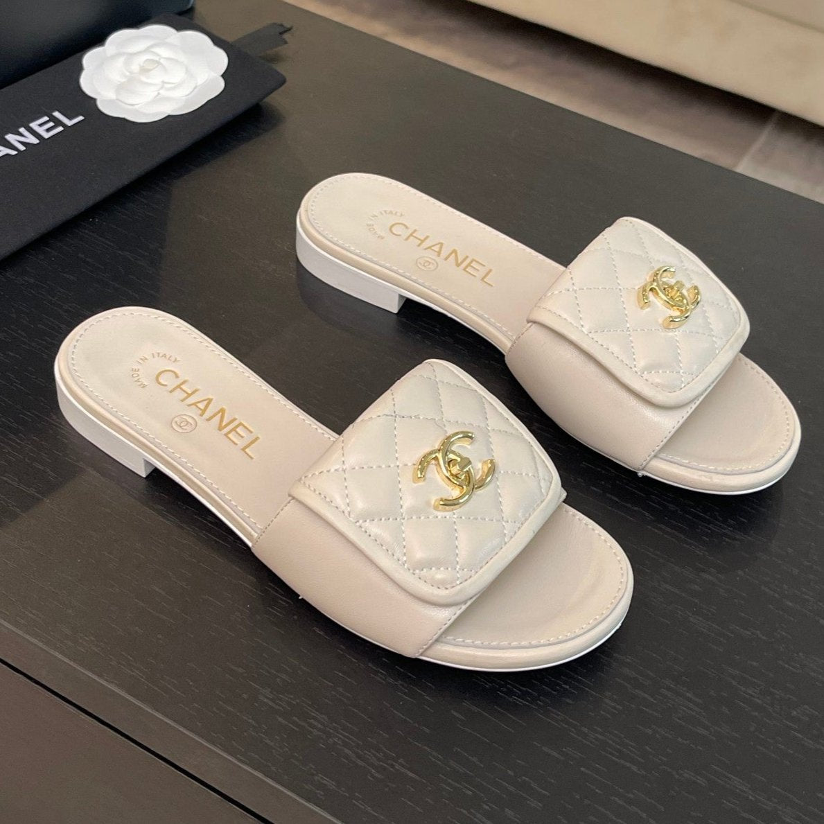 CHANEL FLAT MULE IN WHITE LAMBSKIN