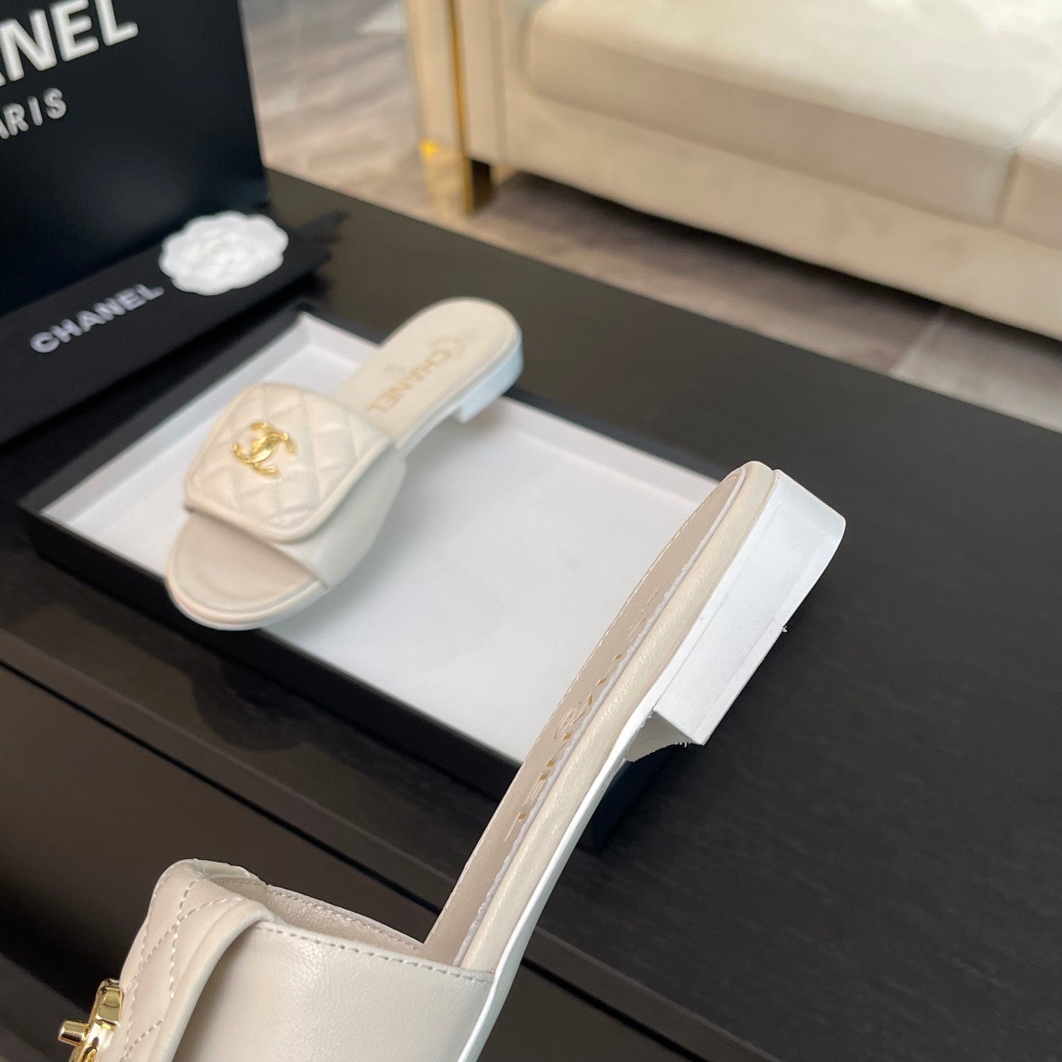 CHANEL FLAT MULE IN WHITE LAMBSKIN