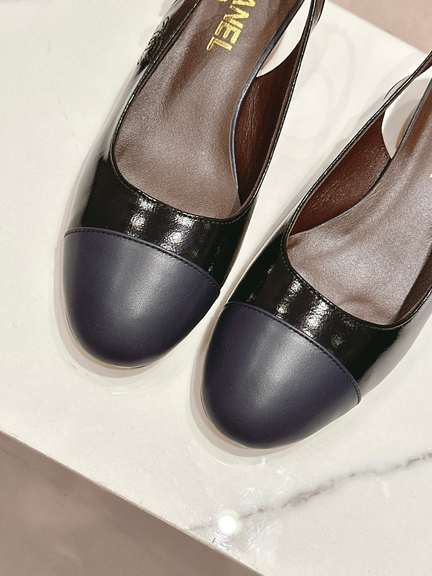 CHANEL SLINGBACKS IN BLACK SHEEPSKIN