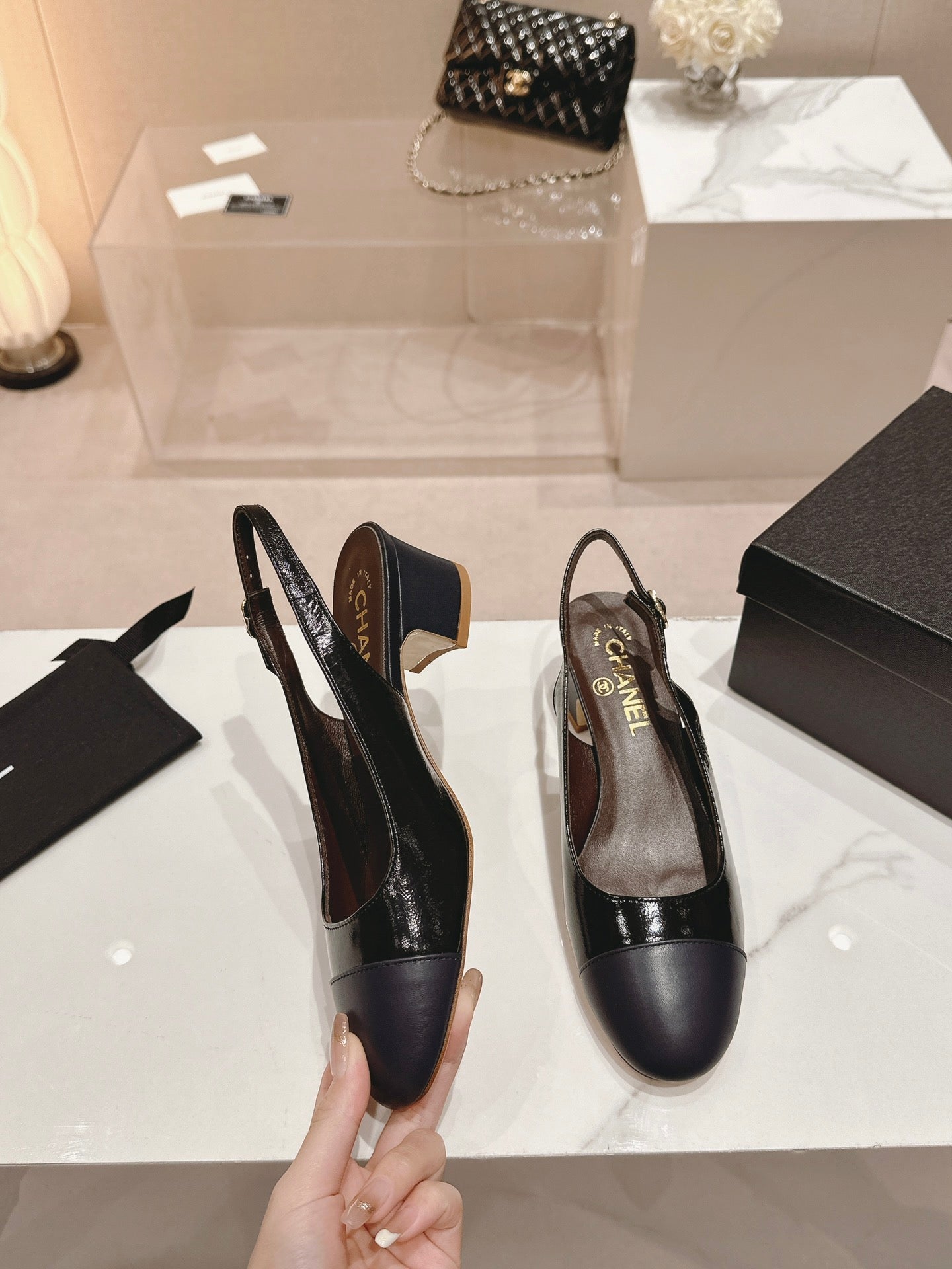 CHANEL SLINGBACKS IN BLACK SHEEPSKIN