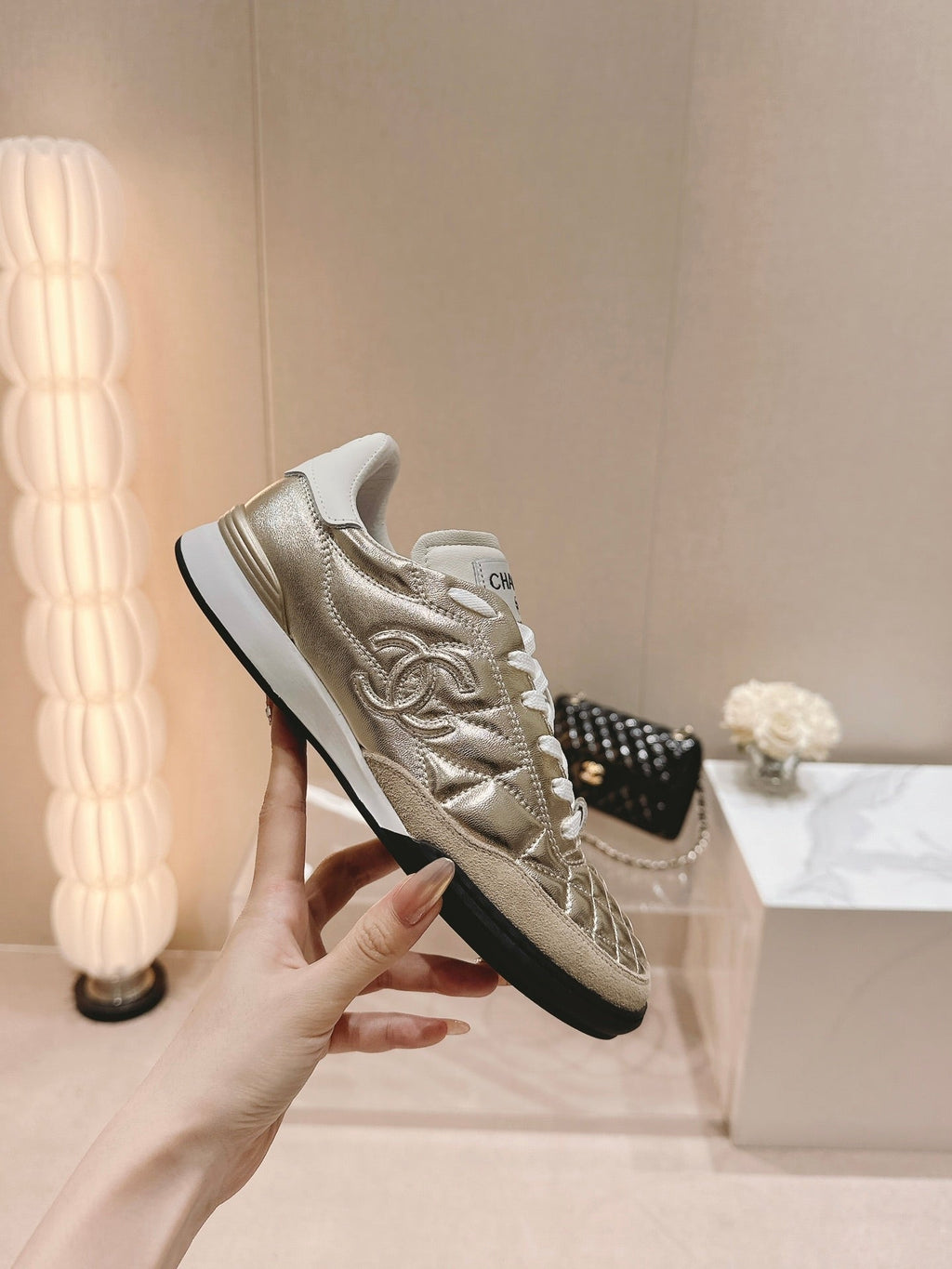 CHANEL SNEAKERS IN GLOSSY GOLDEN LAMBSKIN