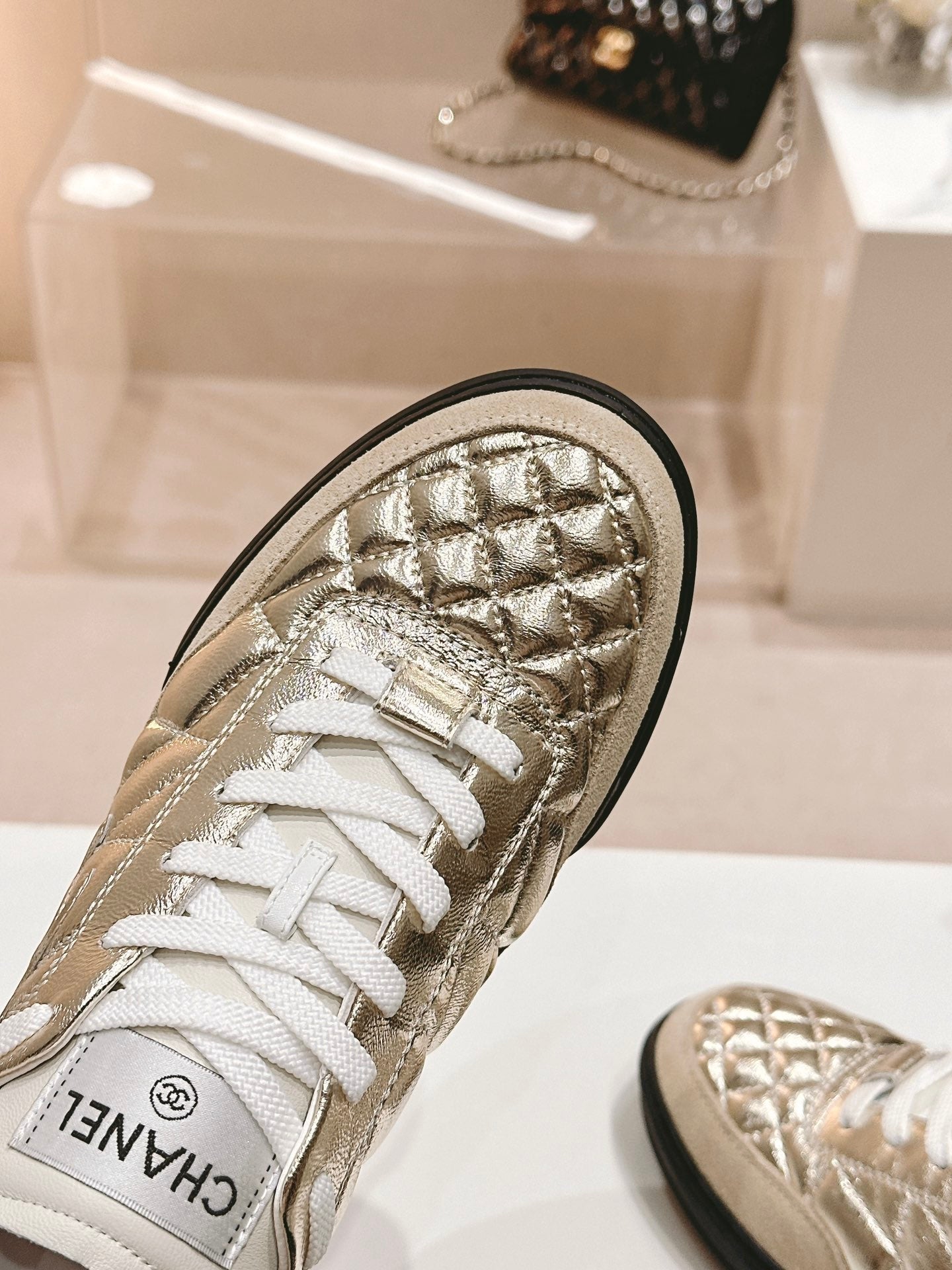 CHANEL SNEAKERS IN GLOSSY GOLDEN LAMBSKIN