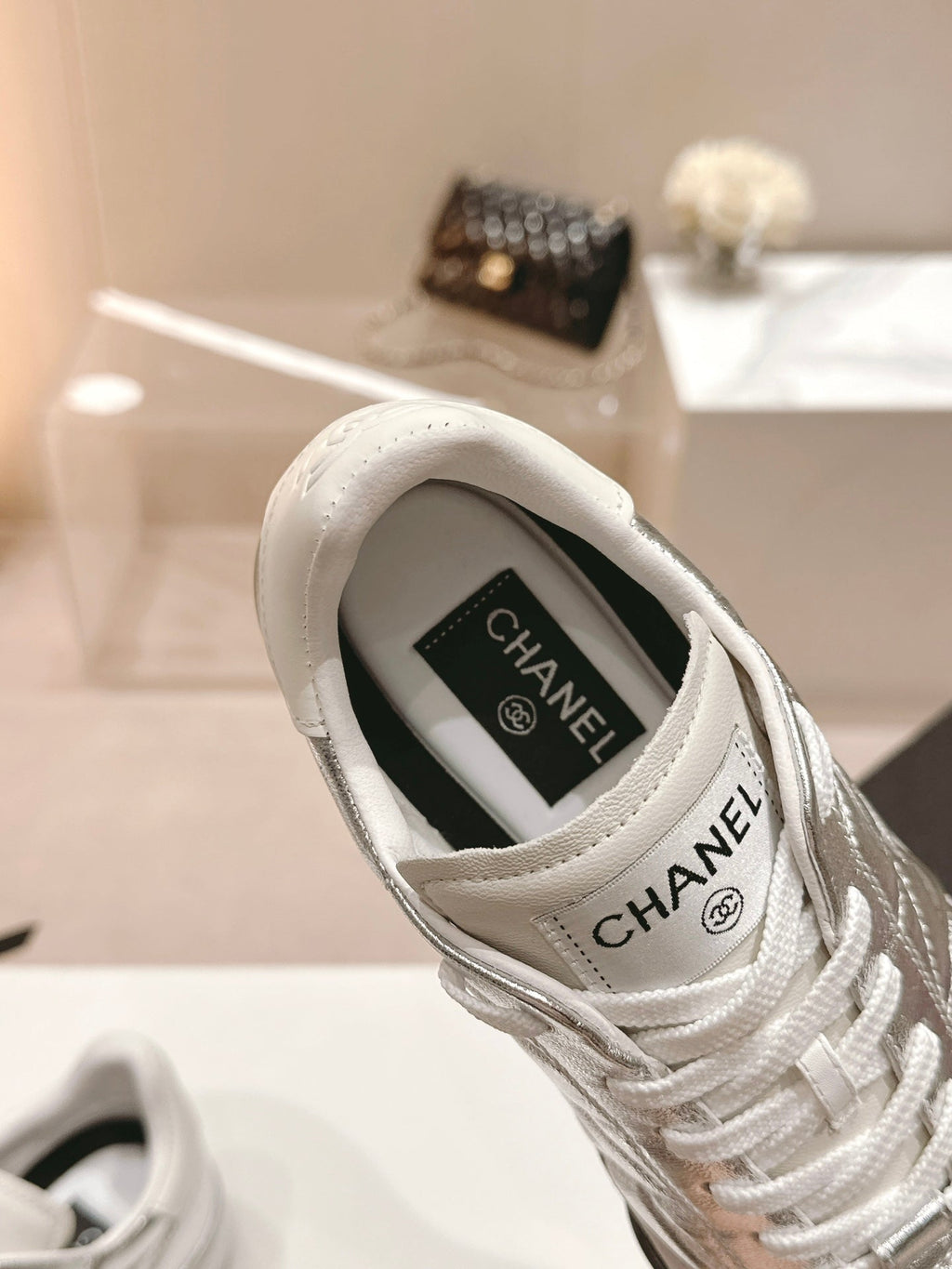 CHANEL SNEAKERS IN GLOSSY SILVER LAMBSKIN