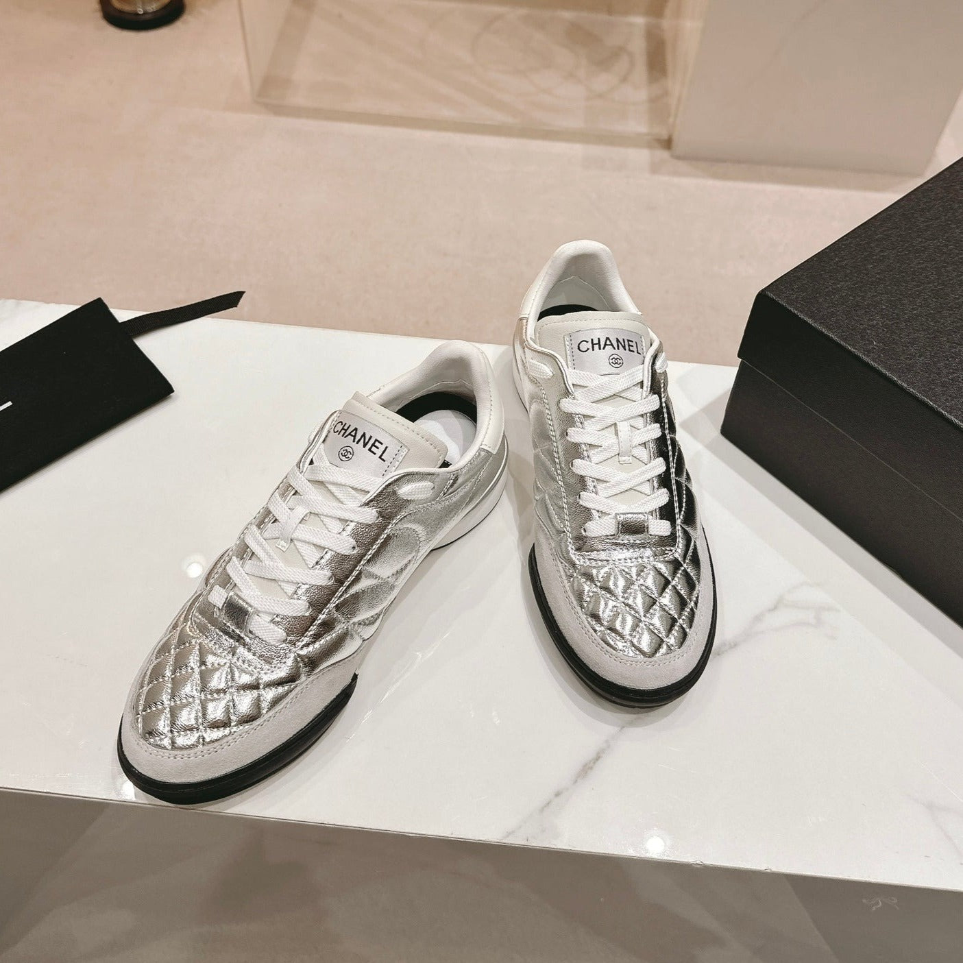 CHANEL SNEAKERS IN GLOSSY SILVER LAMBSKIN