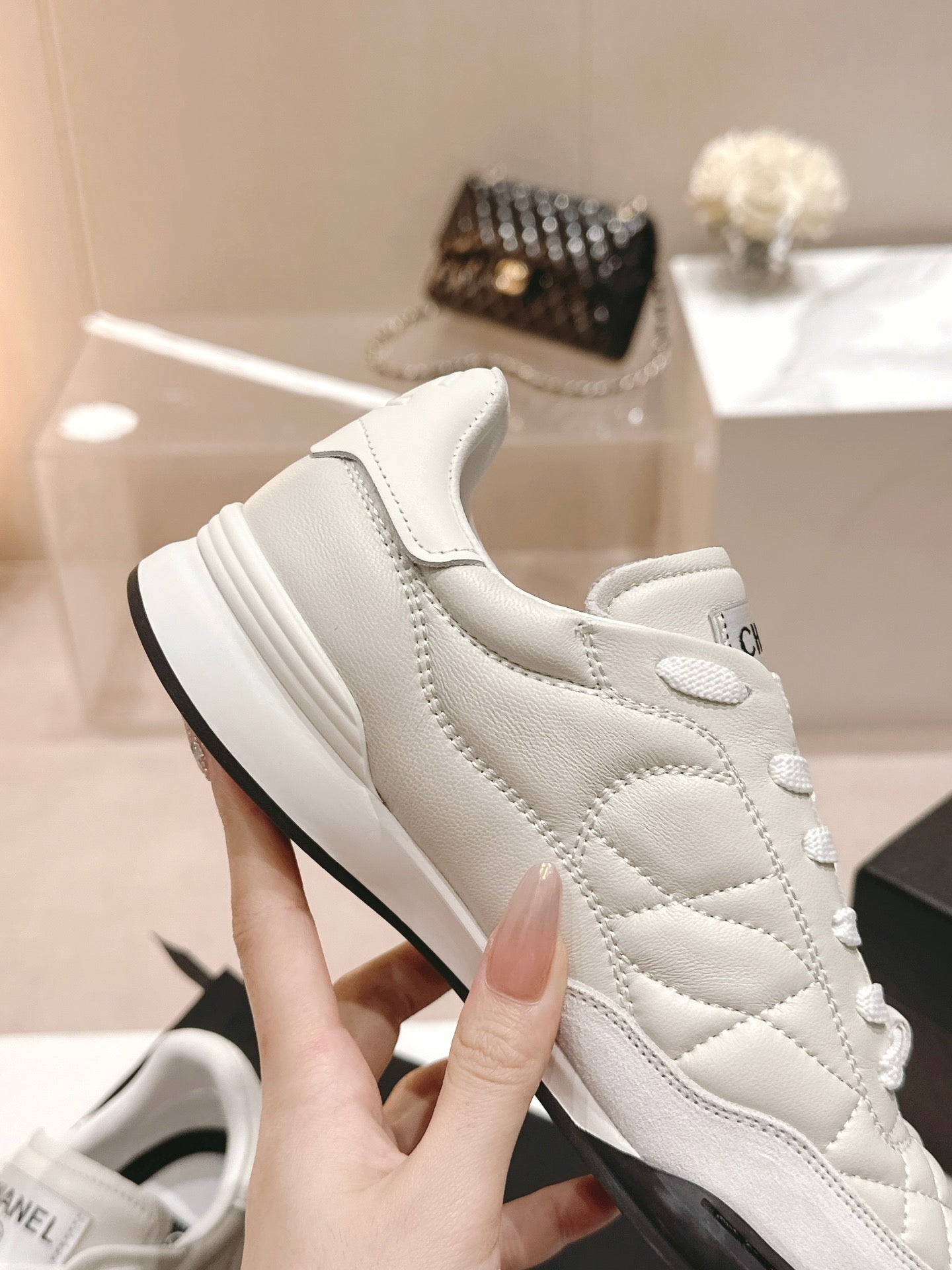 CHANEL SNEAKERS IN GLOSSY WHITE LAMBSKIN