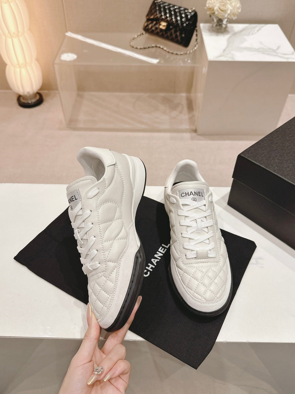CHANEL SNEAKERS IN GLOSSY WHITE LAMBSKIN