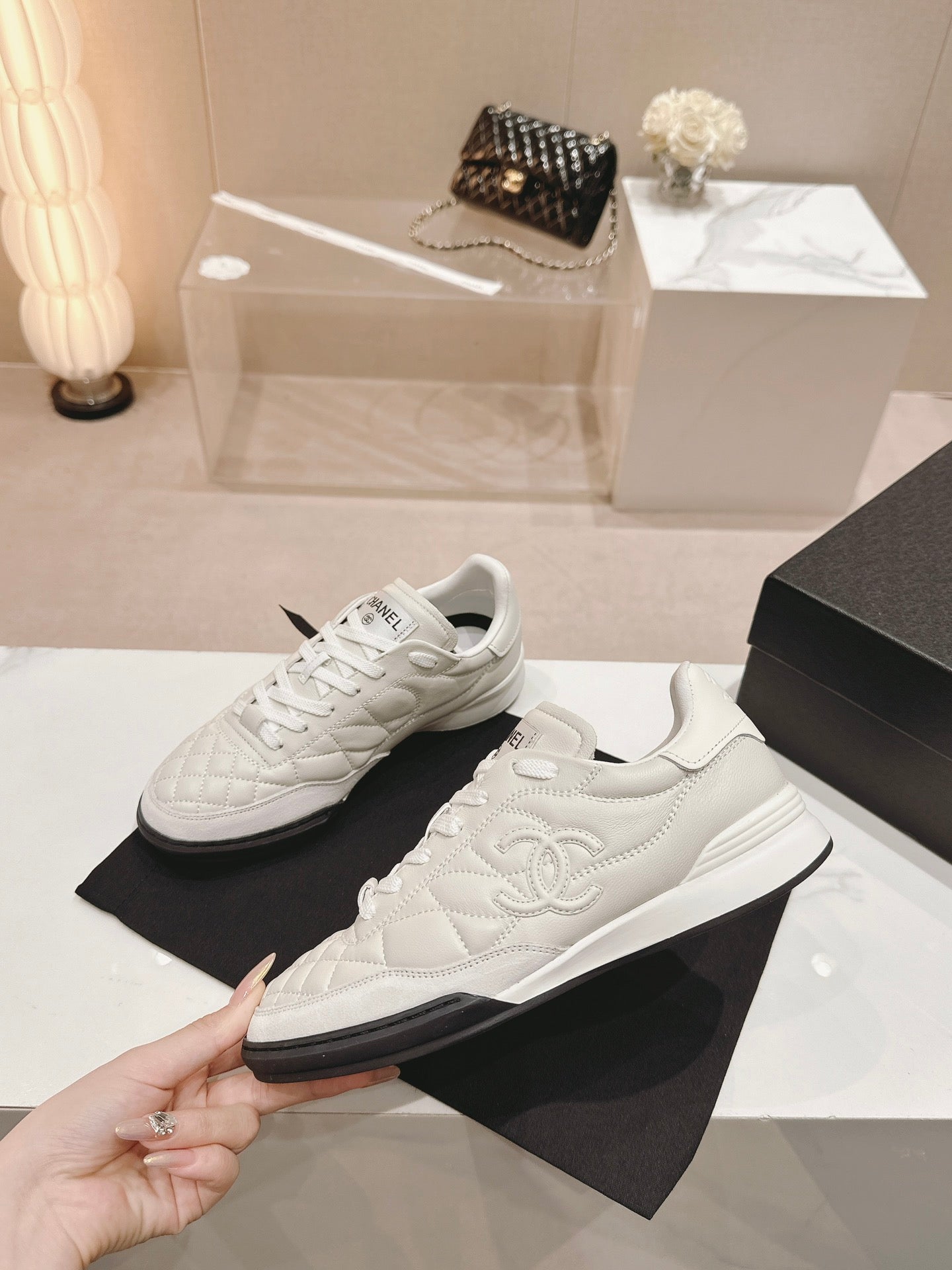 CHANEL SNEAKERS IN GLOSSY WHITE LAMBSKIN