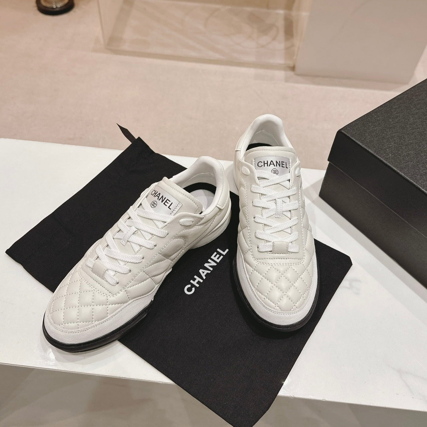 CHANEL SNEAKERS IN GLOSSY WHITE LAMBSKIN