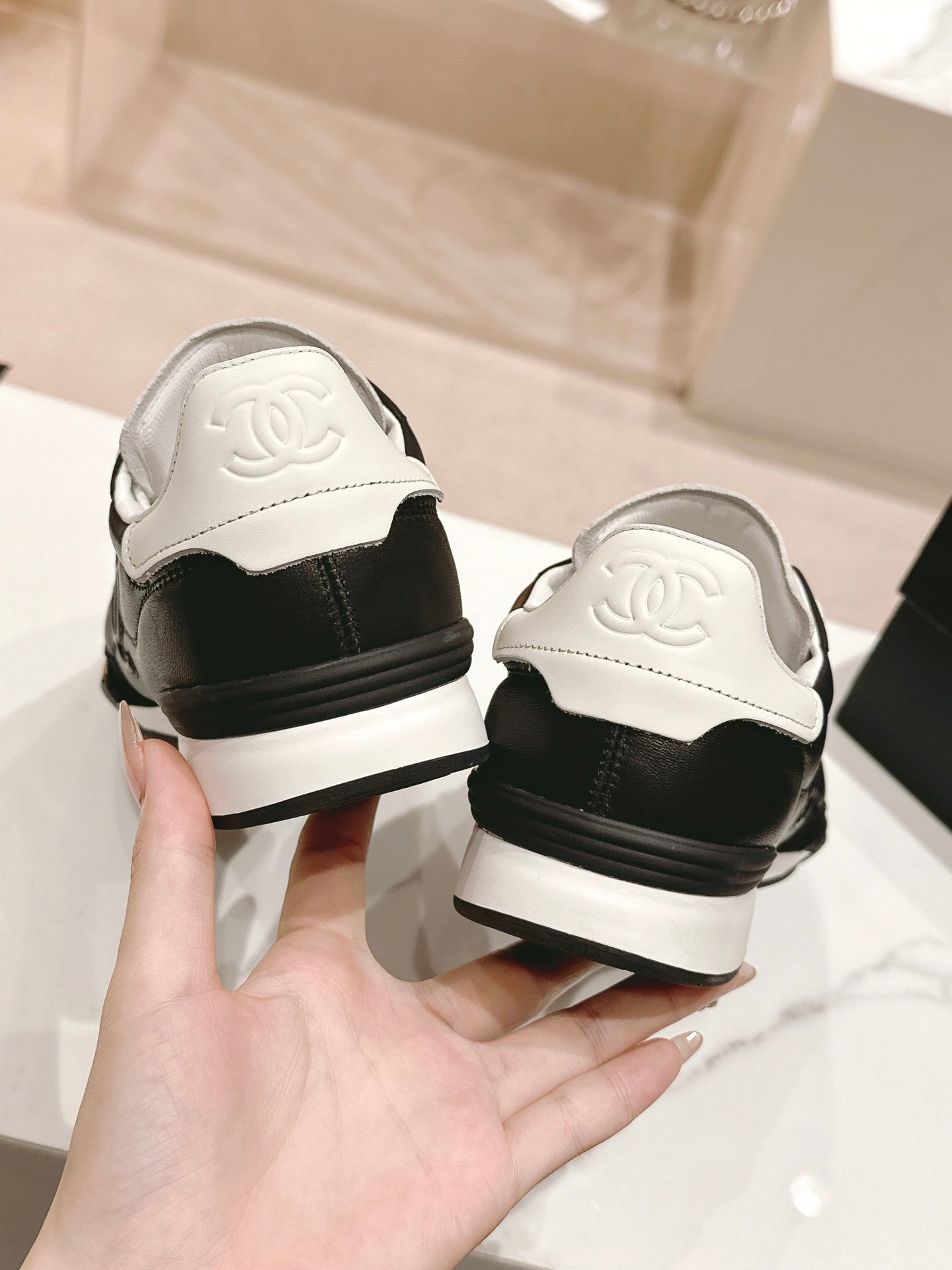 CHANEL SNEAKERS IN GLOSSY BLACK LAMBSKIN