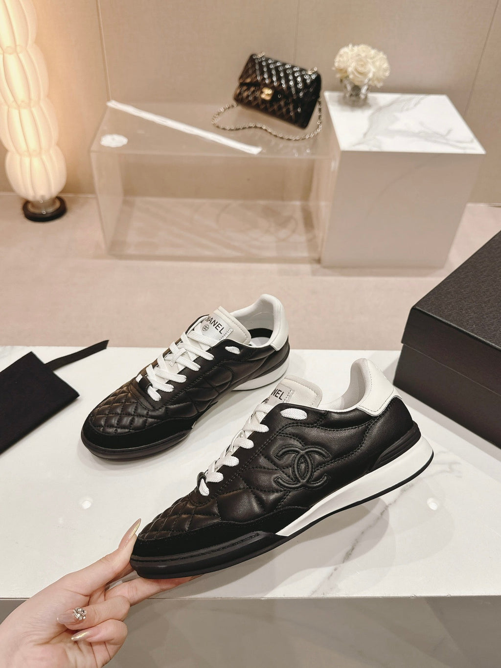 CHANEL SNEAKERS IN GLOSSY BLACK LAMBSKIN