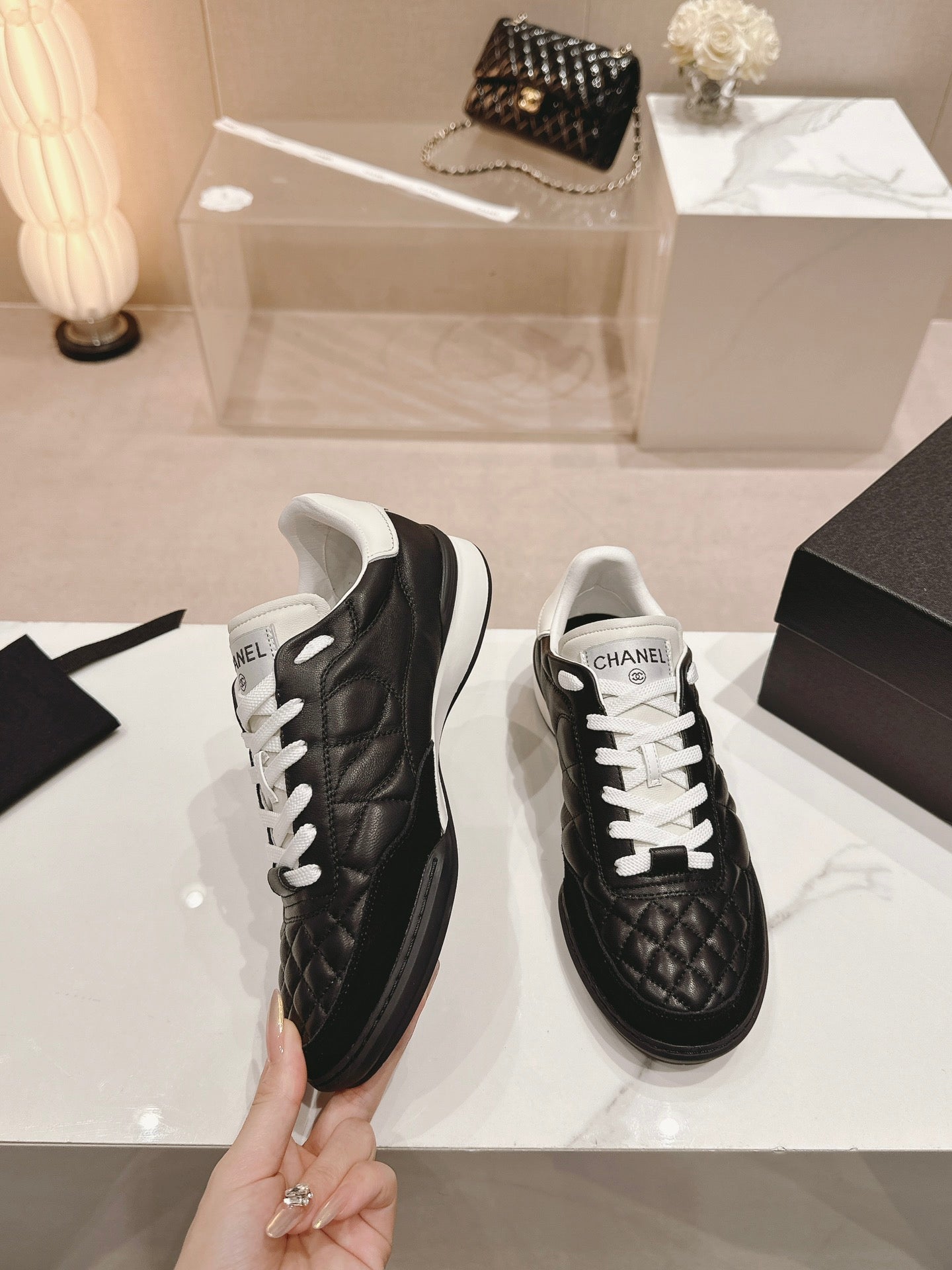 CHANEL SNEAKERS IN GLOSSY BLACK LAMBSKIN