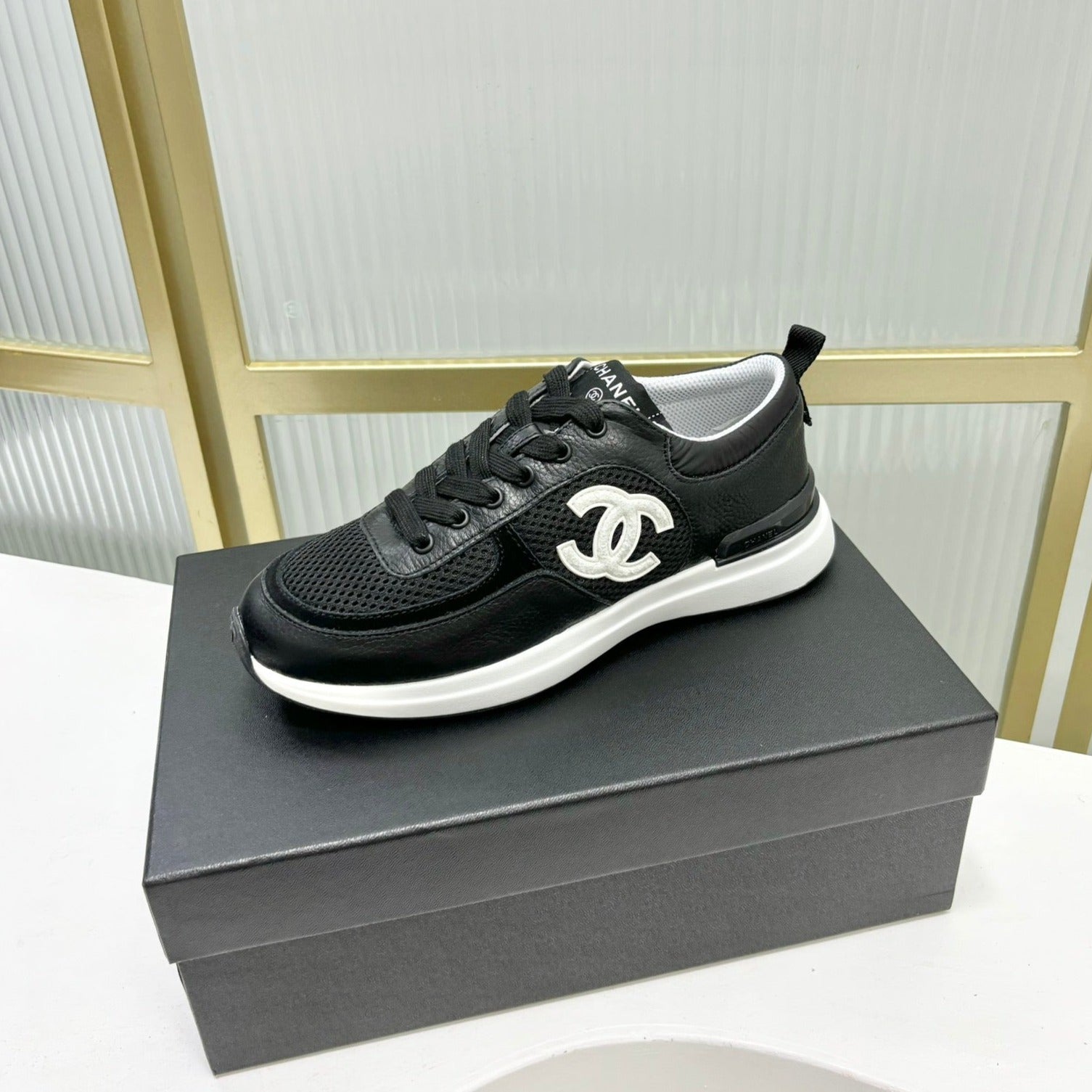 CHANEL SNEAKER IN BLACK SUEDE WITH WHITE LOGO