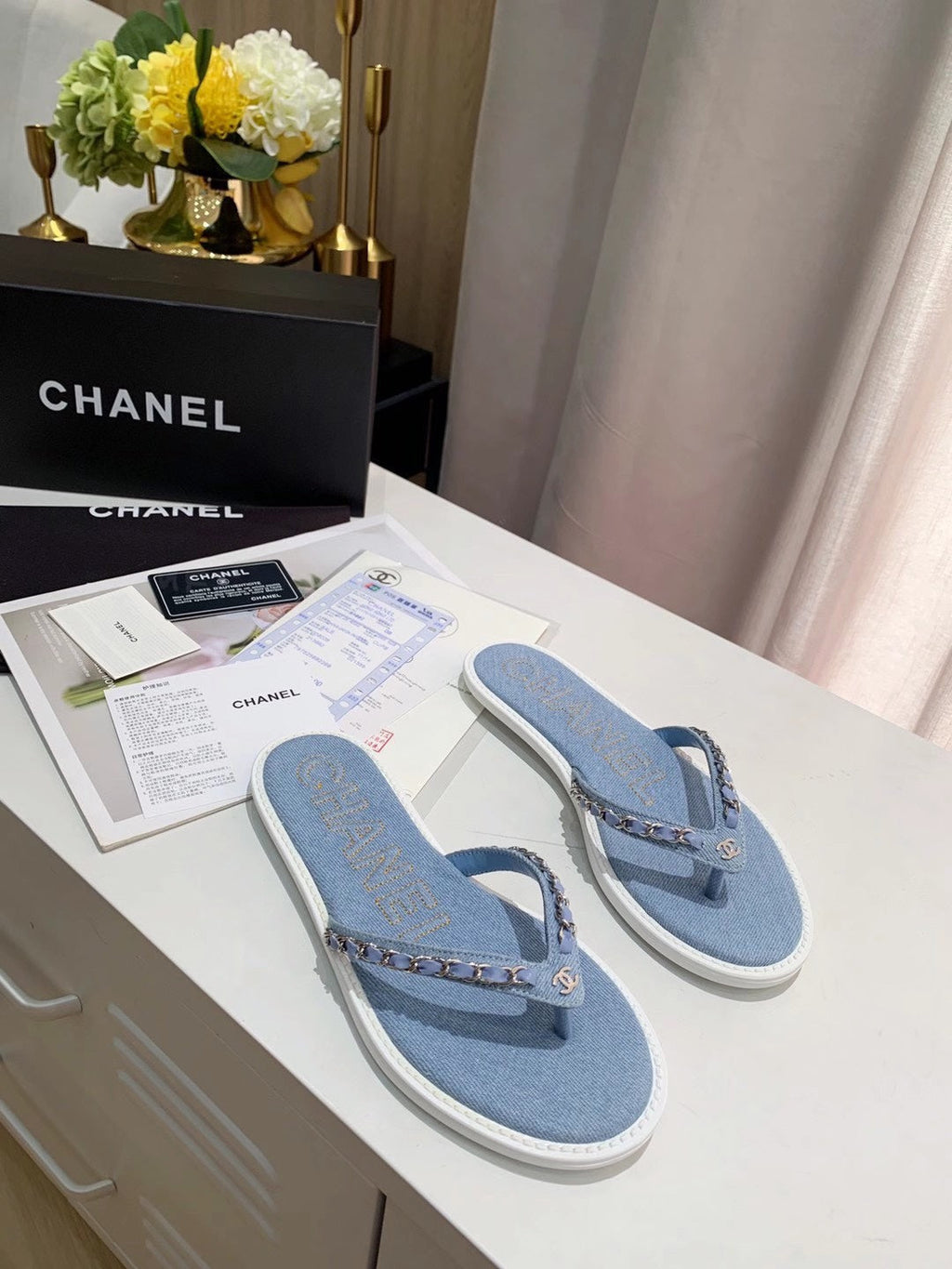 CHANEL THONG SLIPPERS IN LIGHT BLUE DENIM