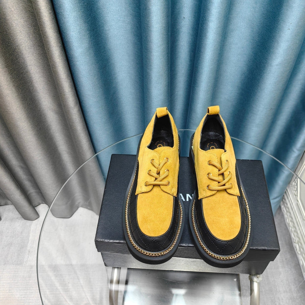 CHANEL OXFORD SHOES IN GOLD YELLOW SUEDE AND BLACK SHEEPSKIN