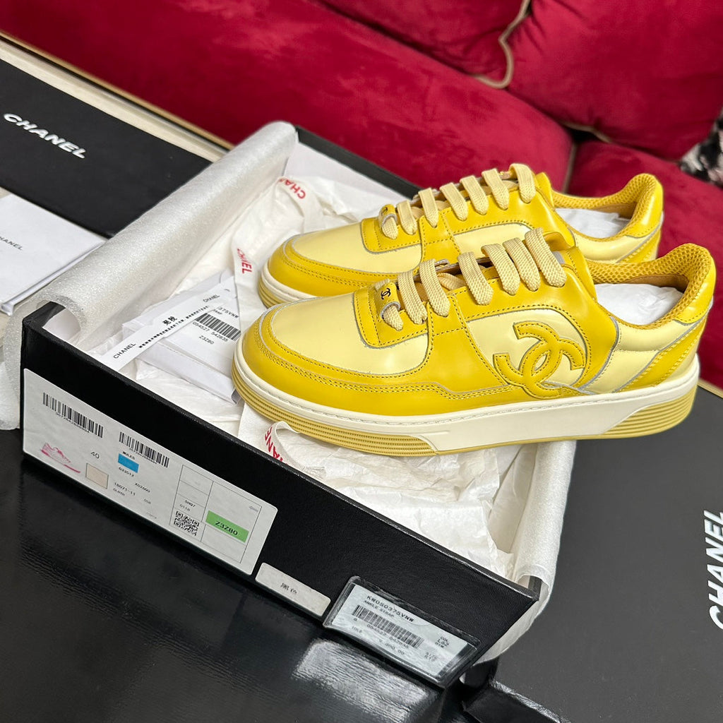 CHANEL TRAINERS IN BRIGHT YELLOW SHINY CALFSKIN