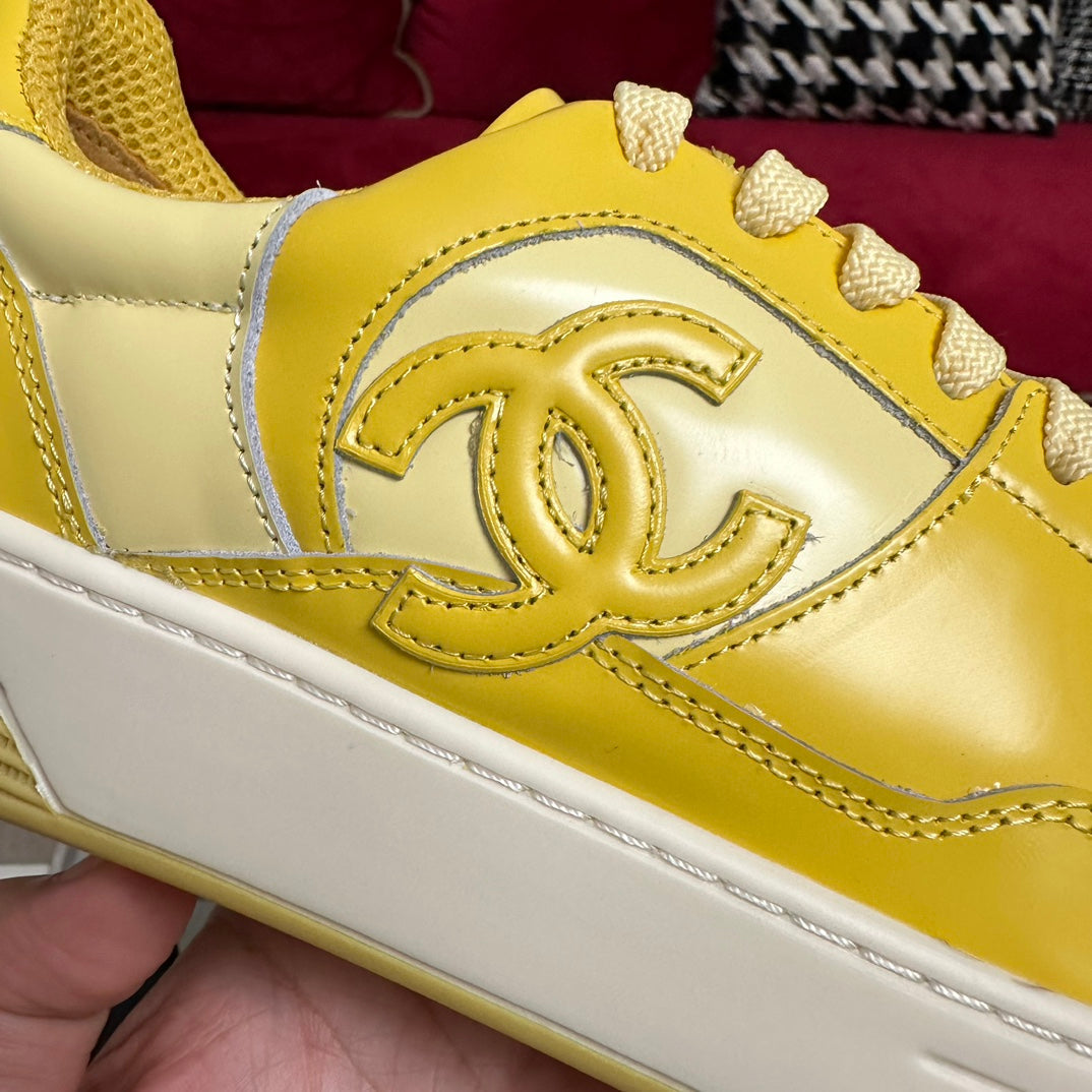 CHANEL TRAINERS IN BRIGHT YELLOW SHINY CALFSKIN