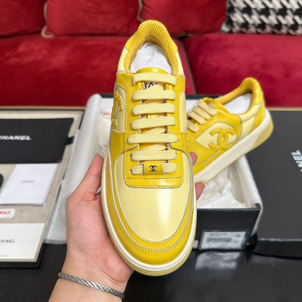 CHANEL TRAINERS IN BRIGHT YELLOW SHINY CALFSKIN