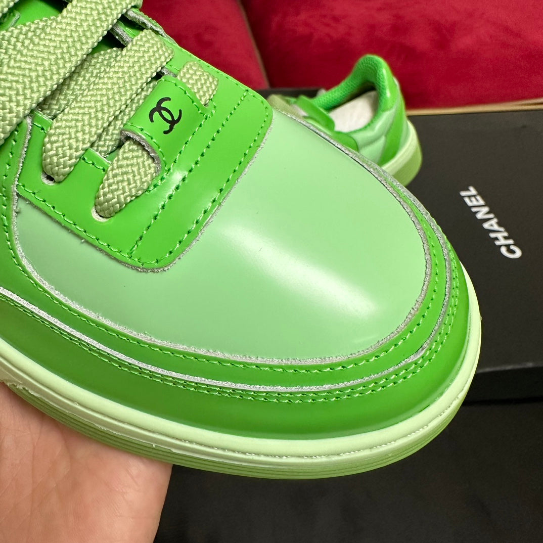 CHANEL TRAINERS IN LIGHT GREEN SHINY CALFSKIN