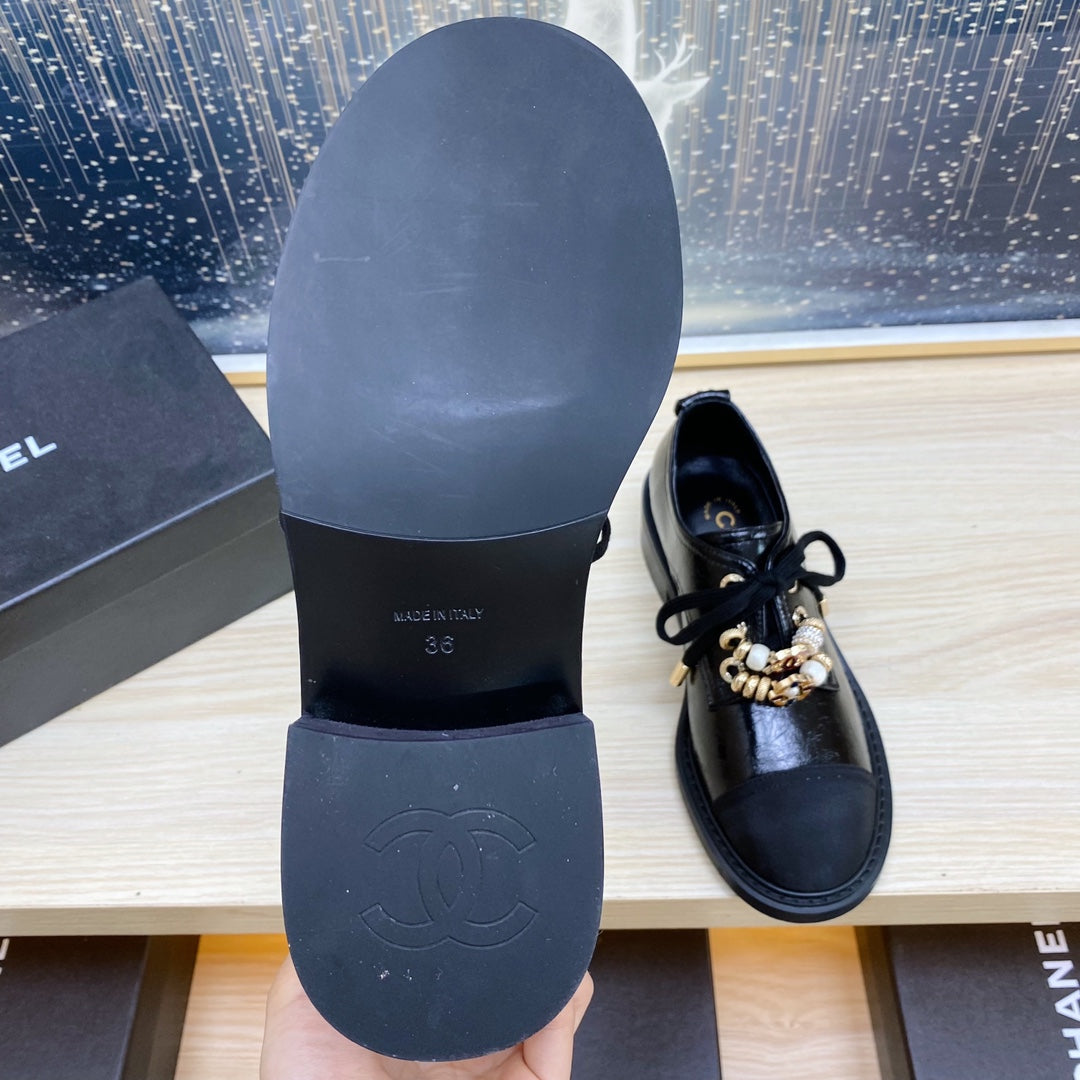 CHANEL COMBAT OXFORD SHOES IN BLACK WRINKLED CALFSKIN AND GROSGRAIN WITH FAUX PEARL