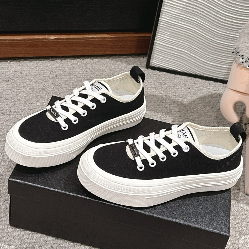 CHANEL LACE-UP SNEAKERS IN BLACK CANVAS