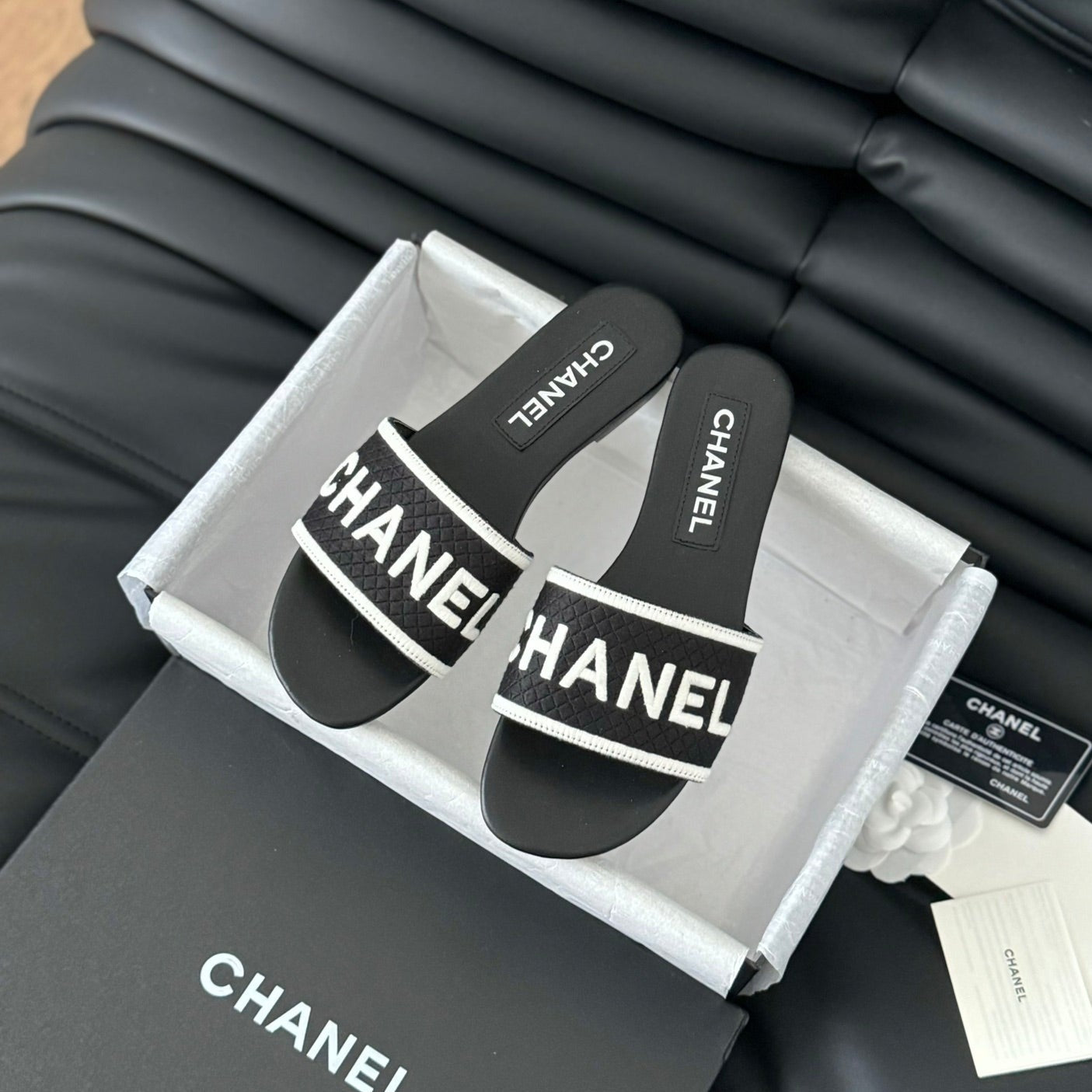 CHANEL Woven Embroidered Letter Slippers Black White