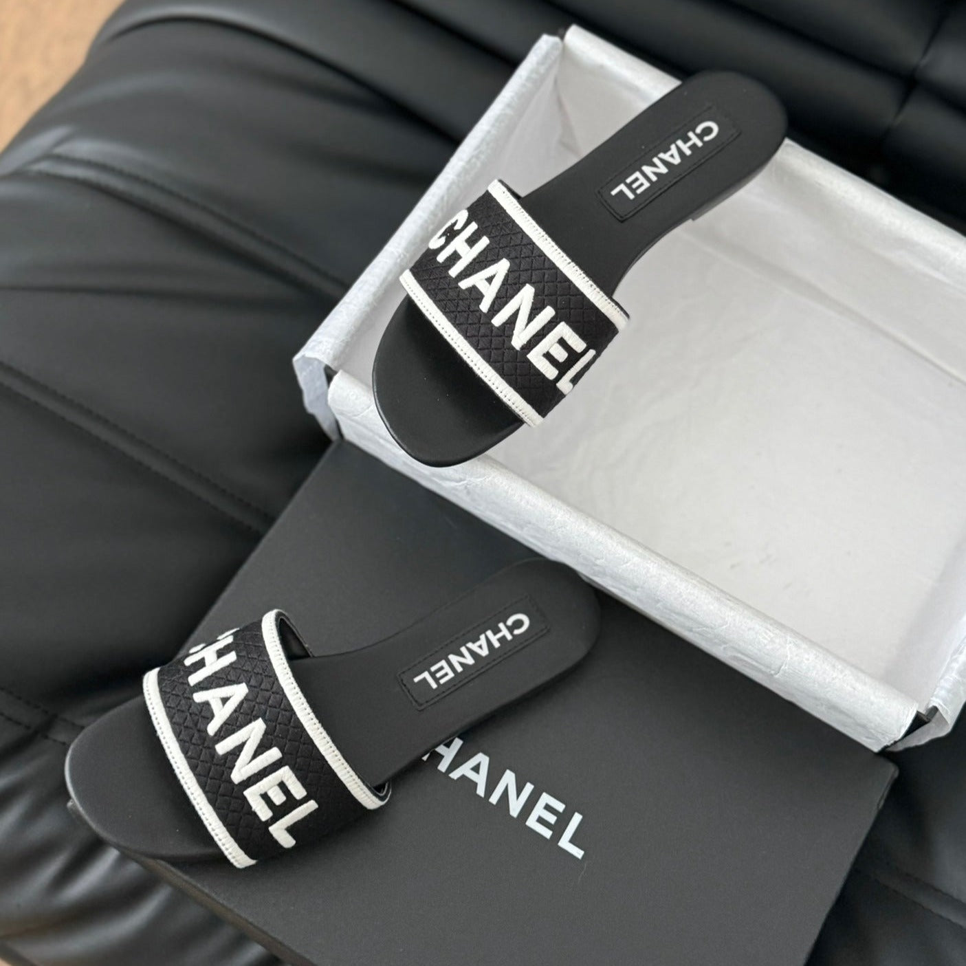 CHANEL Woven Embroidered Letter Slippers Black White
