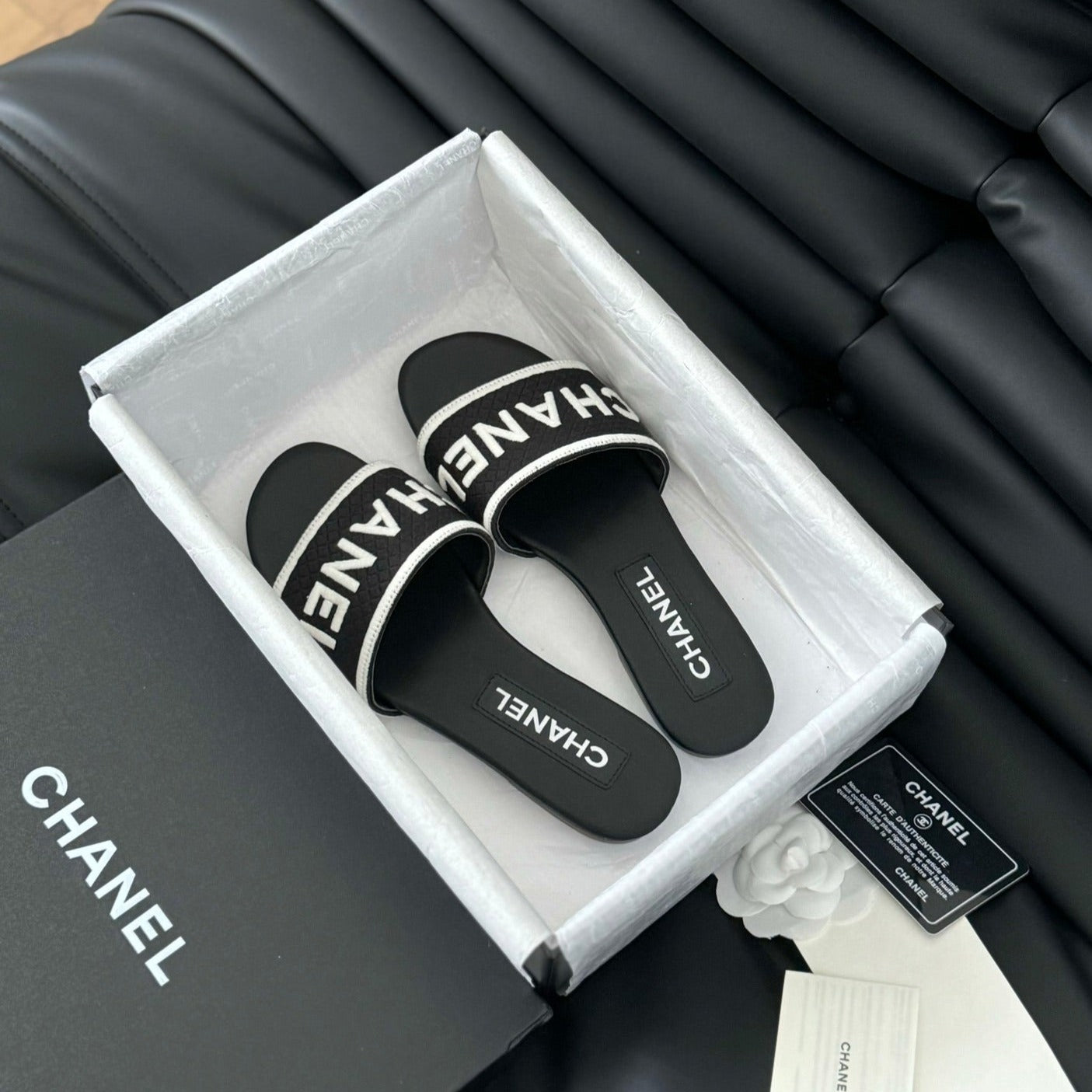 CHANEL Woven Embroidered Letter Slippers Black White