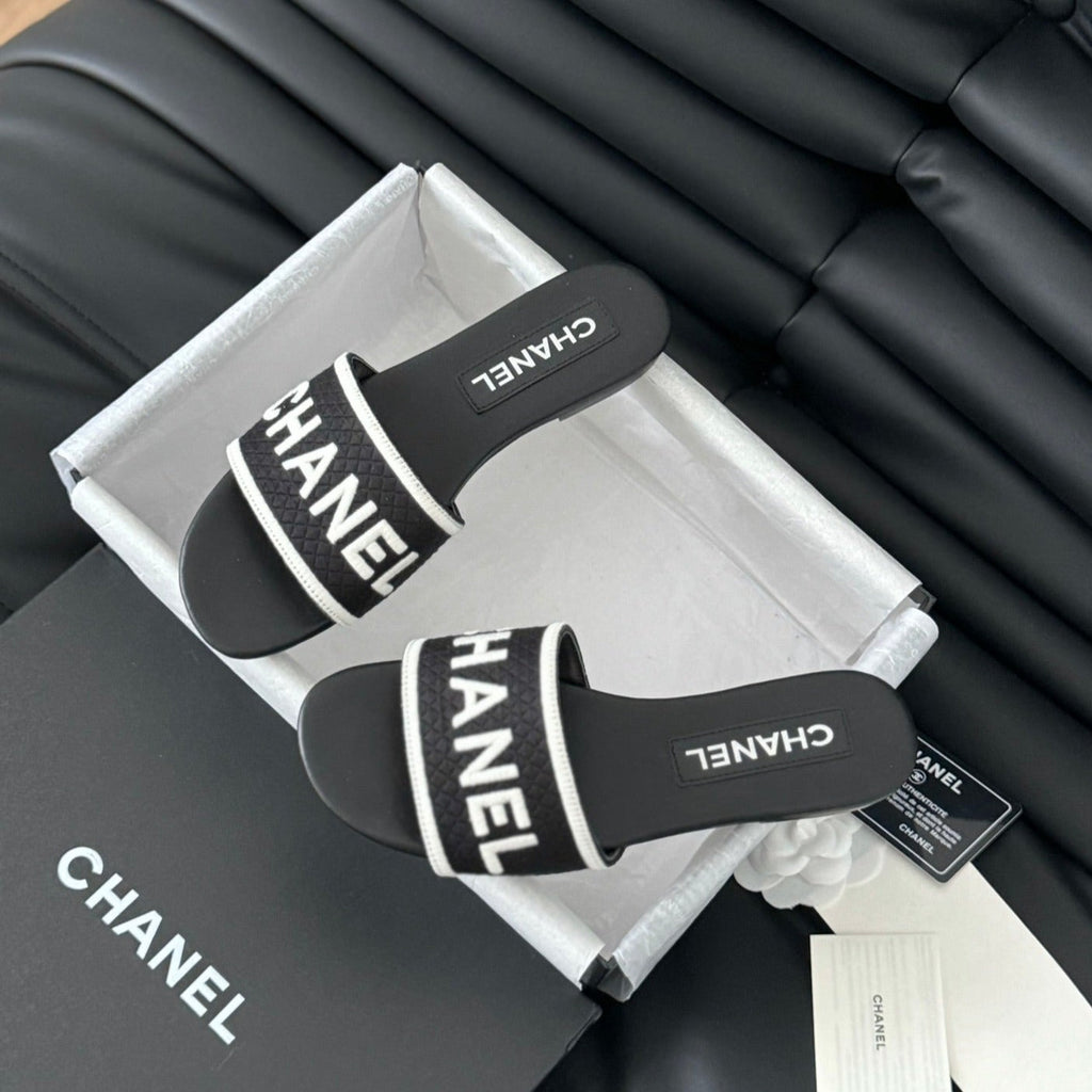 CHANEL Woven Embroidered Letter Slippers Black White