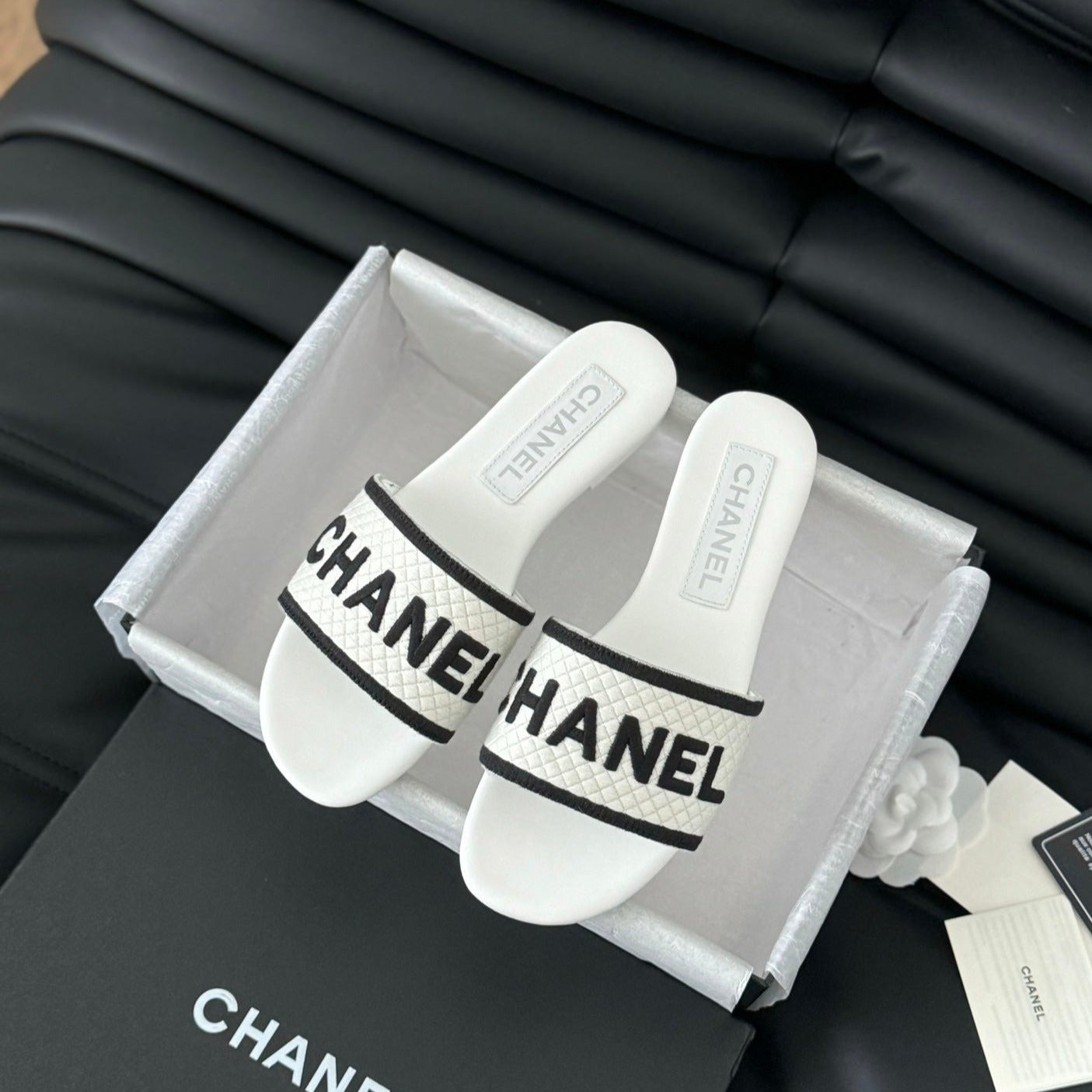 CHANEL Woven Embroidered Letter Slippers White Black