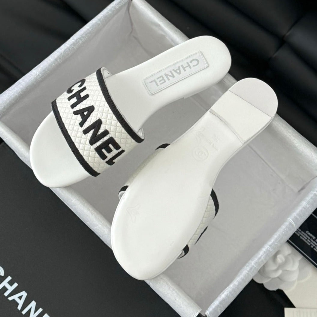 CHANEL Woven Embroidered Letter Slippers White Black