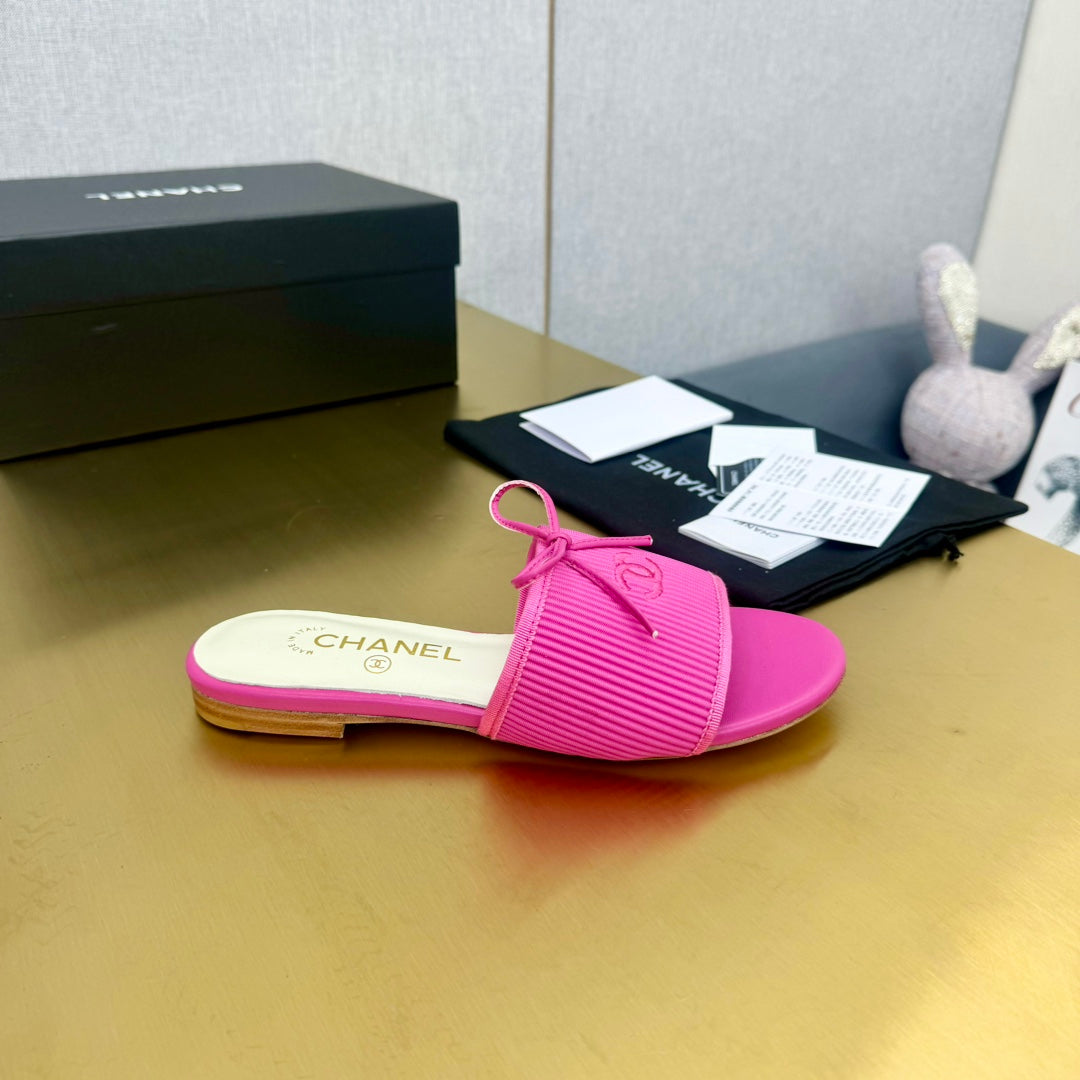 CHANEL BOW SLIPPERS IN BRIGHT PINK LAMBSKIN