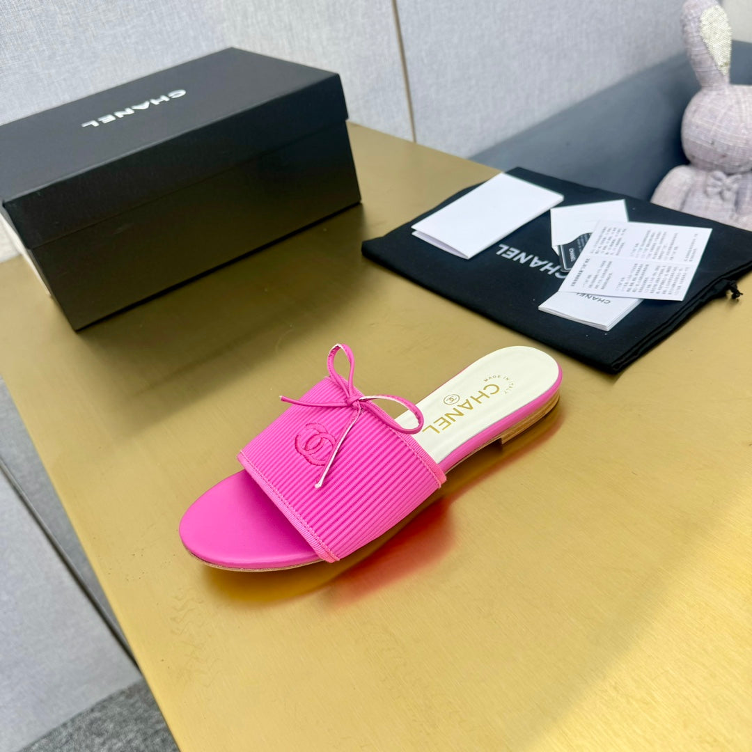 CHANEL BOW SLIPPERS IN BRIGHT PINK LAMBSKIN