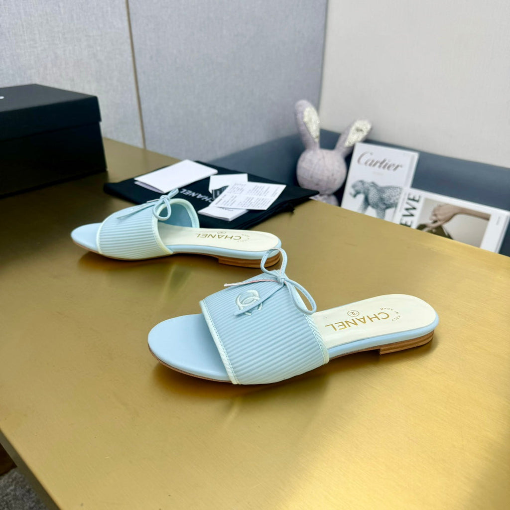CHANEL BOW SLIPPERS IN LIGHT BLUE LAMBSKIN