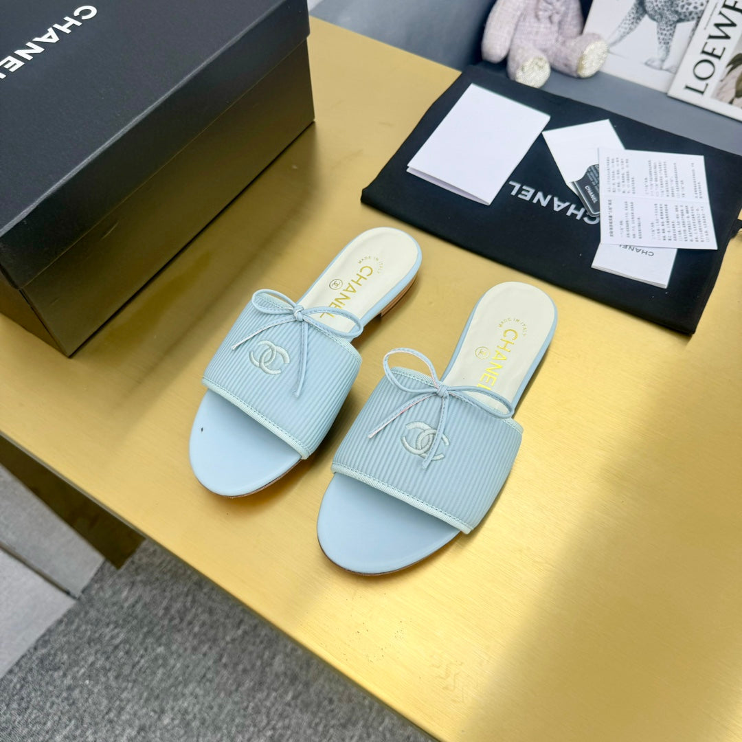 CHANEL BOW SLIPPERS IN LIGHT BLUE LAMBSKIN