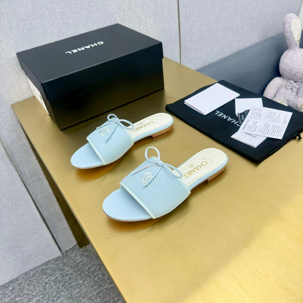 CHANEL BOW SLIPPERS IN LIGHT BLUE LAMBSKIN